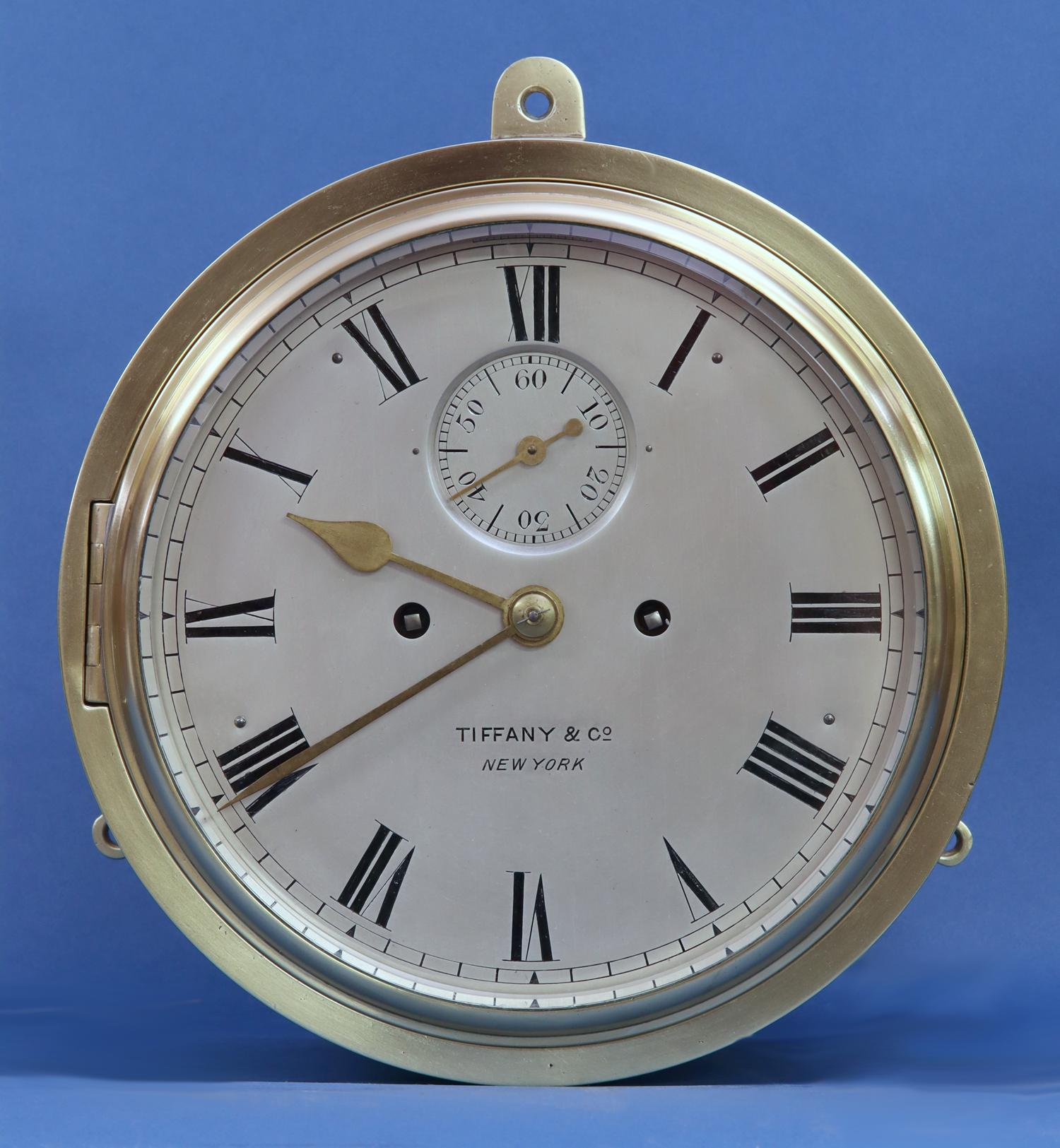 
Makers:	
J.C. Jennens, London.
Retailed by Tiffany & Co, New York.

Description:	
A late-19th century bronze bulkhead clock with ship’s striking including the dog’s watch originally retailed by Tiffany & Co, New York.

Case:	
The circular case has