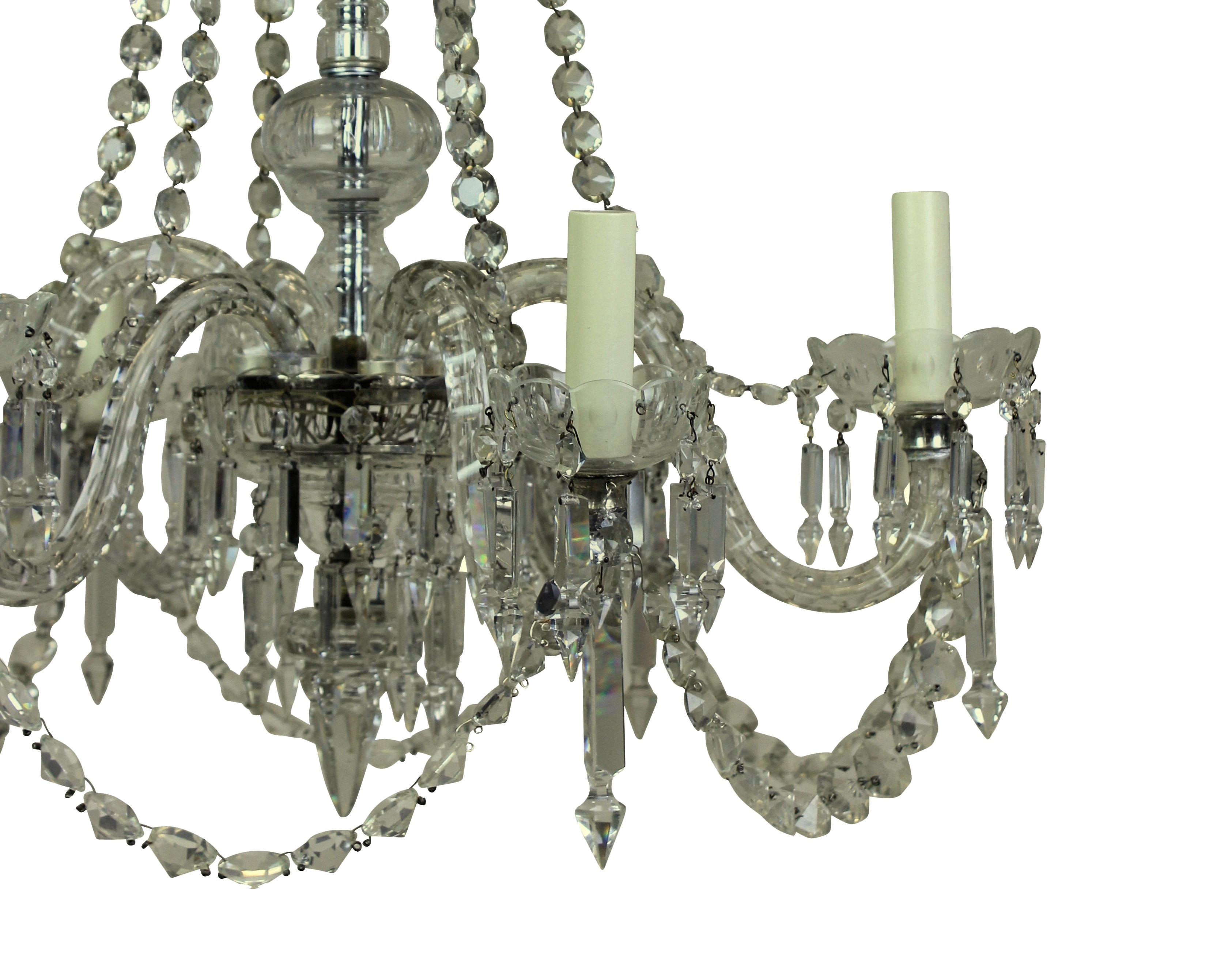 An English cut-glass six-arm chandelier of good quality.