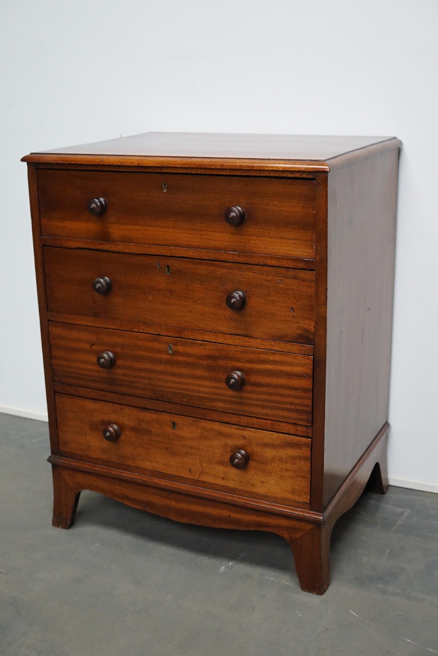 Very nice solid mahogany chest of drawers made circa late 19th century in England. It features 4 drawers with original locks (no keys). It remains in a good antique condition with a nice patina and color. The interior dimensions of the drawers are: