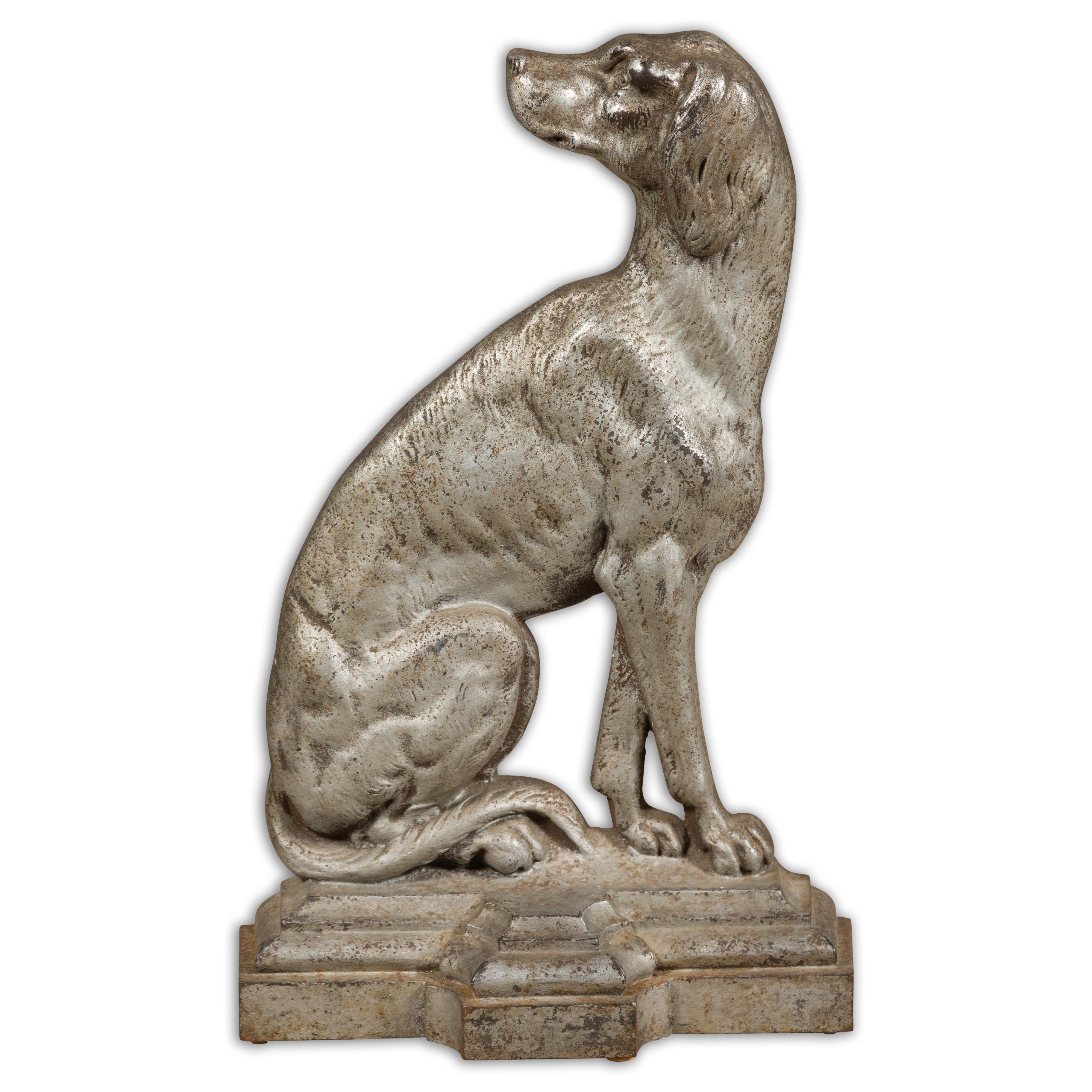 An English Late Victorian period silvered door stop from circa 1880-1900 showcasing a dog depicted in profile. This English Late Victorian period silvered door stop, dating from circa 1880-1900, is a captivating blend of utility and artistry.