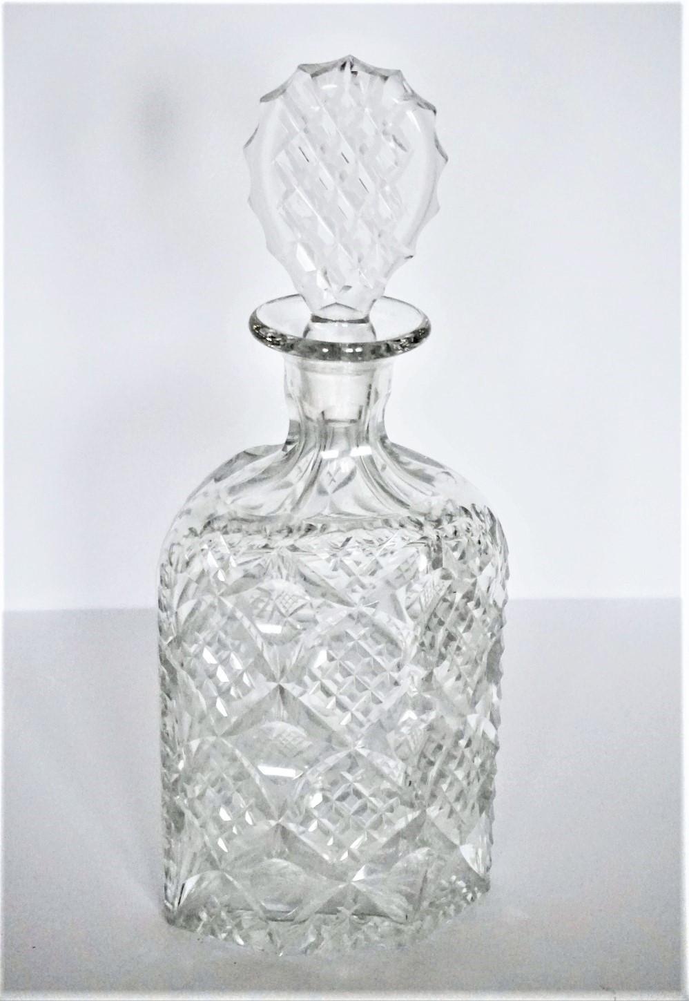 A striking Victorian crystaldecanter with elegant deep hand cut decor design in a rare hexagonal shape, with its original matching stopper, England, 1885-1890. This decanter is of thick crystal glass, suitable for whiskey, cognac or any other solid
