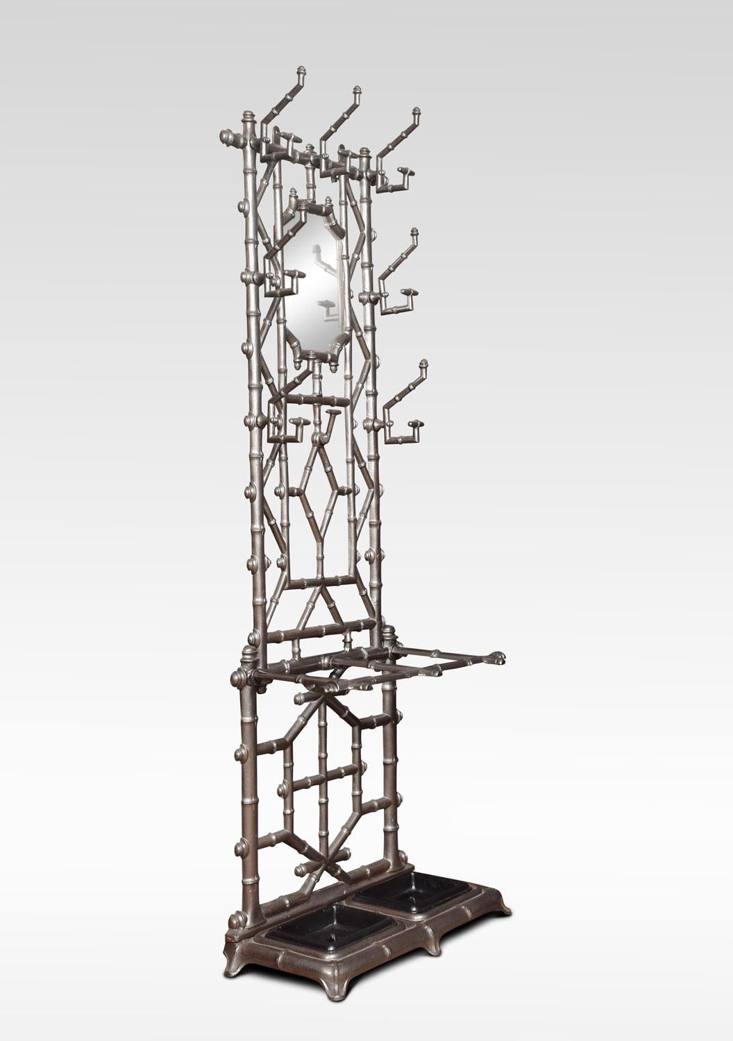 Late Victorian, cast iron hall stand having eight coat and hat hooks surrounding the mirror to centre. The base fitted with umbrella Stand having removable drip trays.
Dimensions
Height 72 inches
Width 25.5 inches
Depth 13.5 inches.