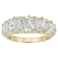 Anello tardo-vittoriano con cinque pietre e diamanti