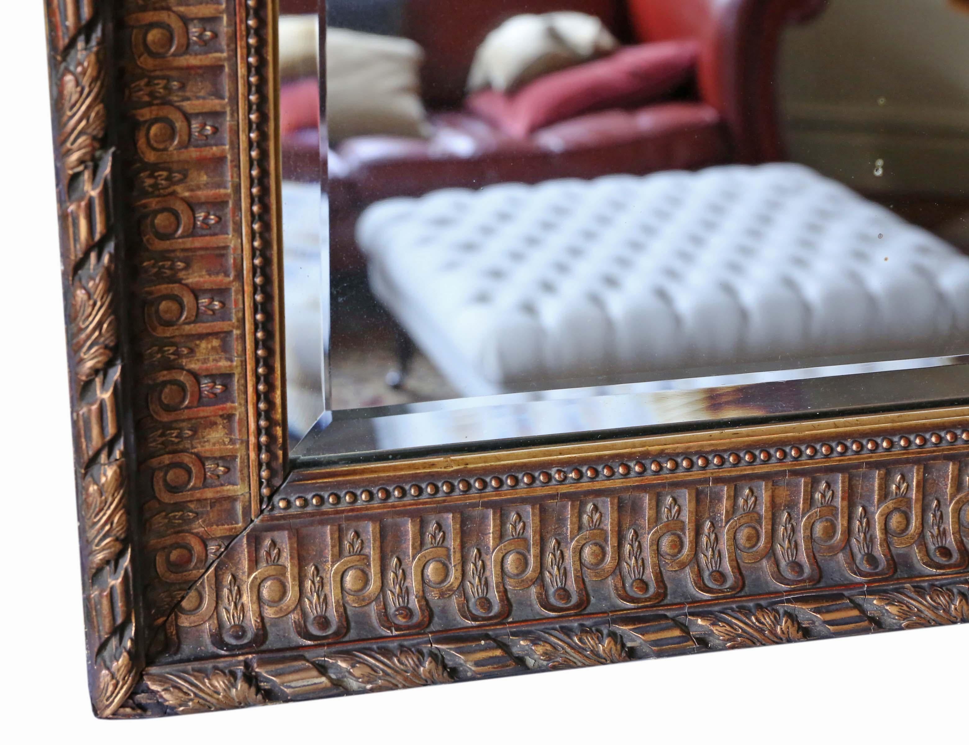 Antique very large late Victorian gilt wall mirror overmantle, circa 1900.
This is a lovely mirror that is full of age, charm and character.
Would look amazing in the right location. Quality period bevel edge glass with light oxidation and hazing