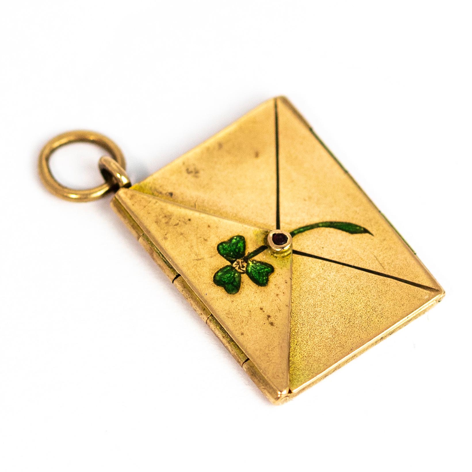 How wonderful is this locket!? The detail starts with the shimmery green clover on the front of the envelope and just below the leaves sit a tiny garnet. When you open the envelope it looks like nothing sits inside but when you open it further there
