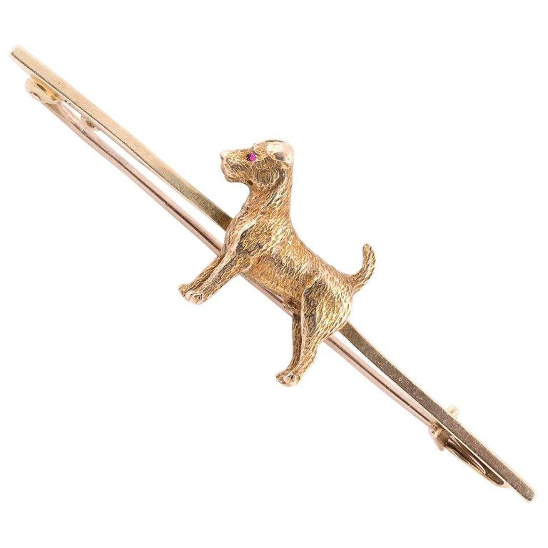 
A Victorian “ Animalier “ 18kt gold dress pin decorated with a fox terrier full figure, overall length 55mm. 