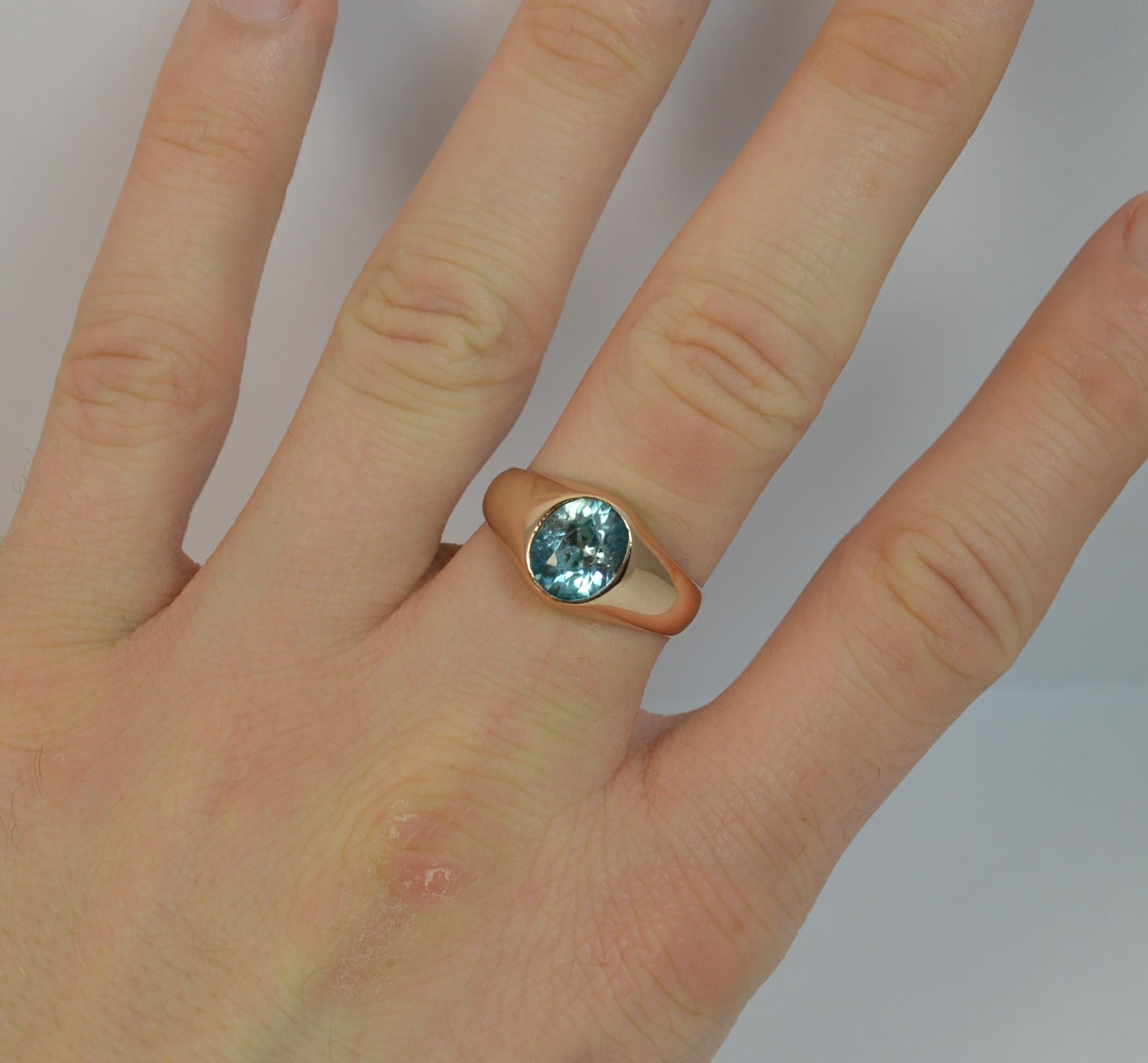 A superb and stylish ladies ring circa 1900.
SIZE ; P 1/2 UK, 7 3/4 US
Modelled in 9 carat rose gold throughout.

Designed with a single large blue zircon in bezel setting. 7.3mm x 9.1mm natural stone.

CONDITION ; Good for age. Solid band, issue