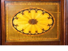 A late victorian inlaid four fold drafts screen, attributed to Hicks of Dublin