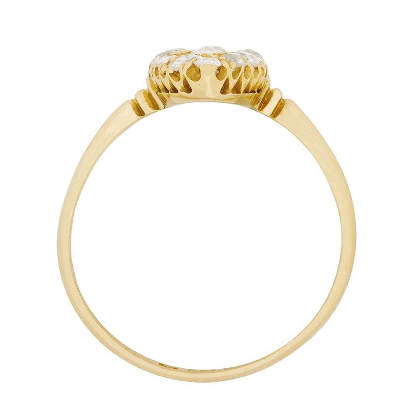 A consummate example of a Victorian era cluster ring, this c.1897 rendition is grain-set on a marquise-shaped bezel with 0.80 carats of old cut diamonds.

The ring’s 18 carat yellow gold setting features a pierced gallery and simple engraved details