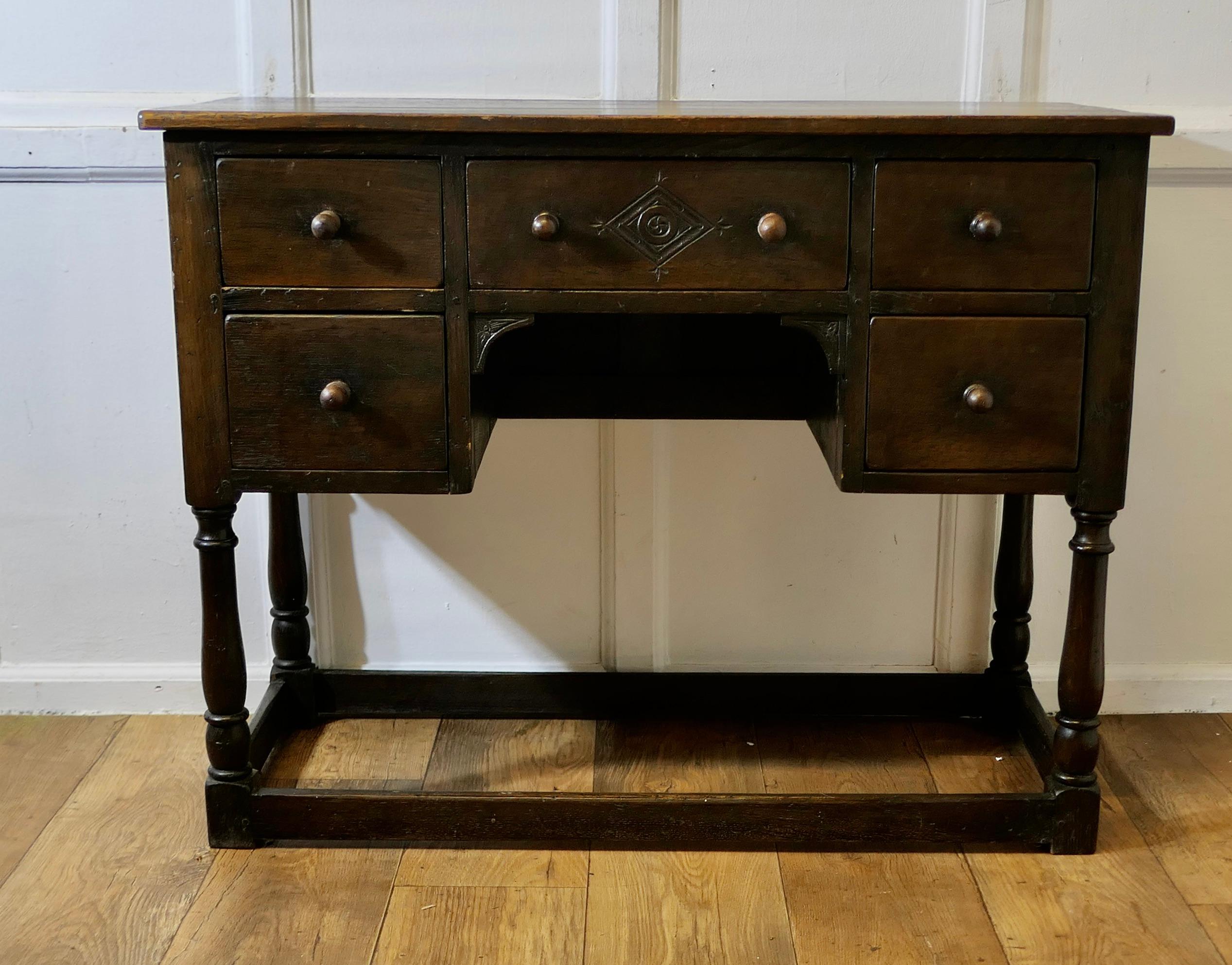 Late Victorian Oak Writing Table 

This is a good solid quality piece made about 1900, with low stretchers and standing on turned legs, the table has 5 drawers the centre one having a geometric carved panel
A good oak table with a good colour and