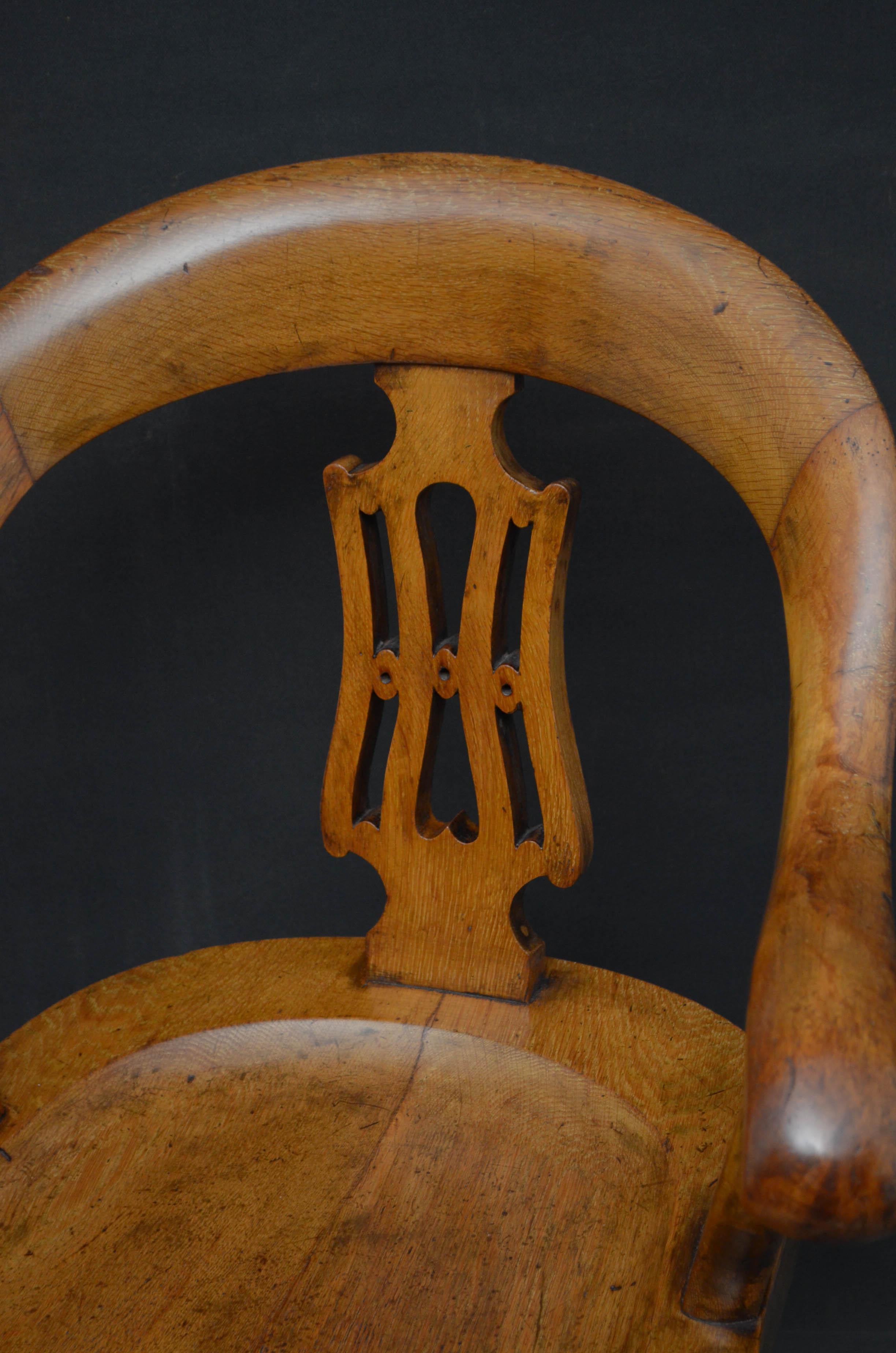 Sn4717 Victorian, oak, revolving office chair, having shaped back rail with carved centre splat and downswept arms and generous seat, all standing on cabriole legs and castors. This antique chair retains its original finish and good patina, ready to