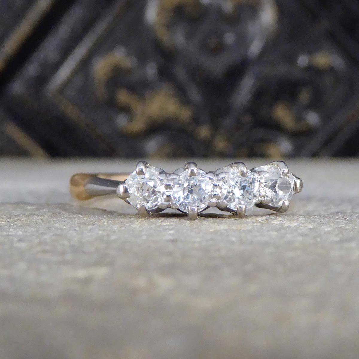 Step back in time with this magnificent Late Victorian Old Cut Diamond four stone ring, a true treasure from an era renowned for its elegance and craftsmanship. Set in luxurious 18ct yellow gold with a white top, this ring features four chunky old