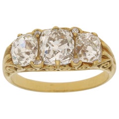 Late Victorian Old Mine Cut Diamond Three-Stone Ring in 18 Karat Yellow Gold