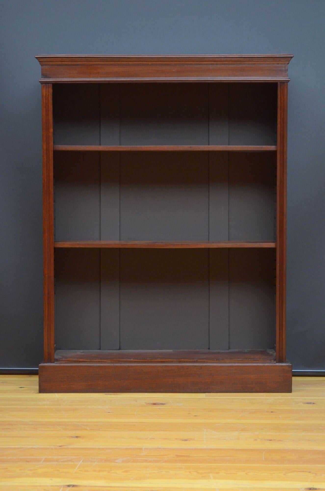 Sn5254 Late Victorian mahogany open bookcase of simple design, having oversailing top above three shelves (only 2 on the photos) flanked by reeded pilasters, all standing on moulded plinth base. This antique bookcase is in home ready condition.
