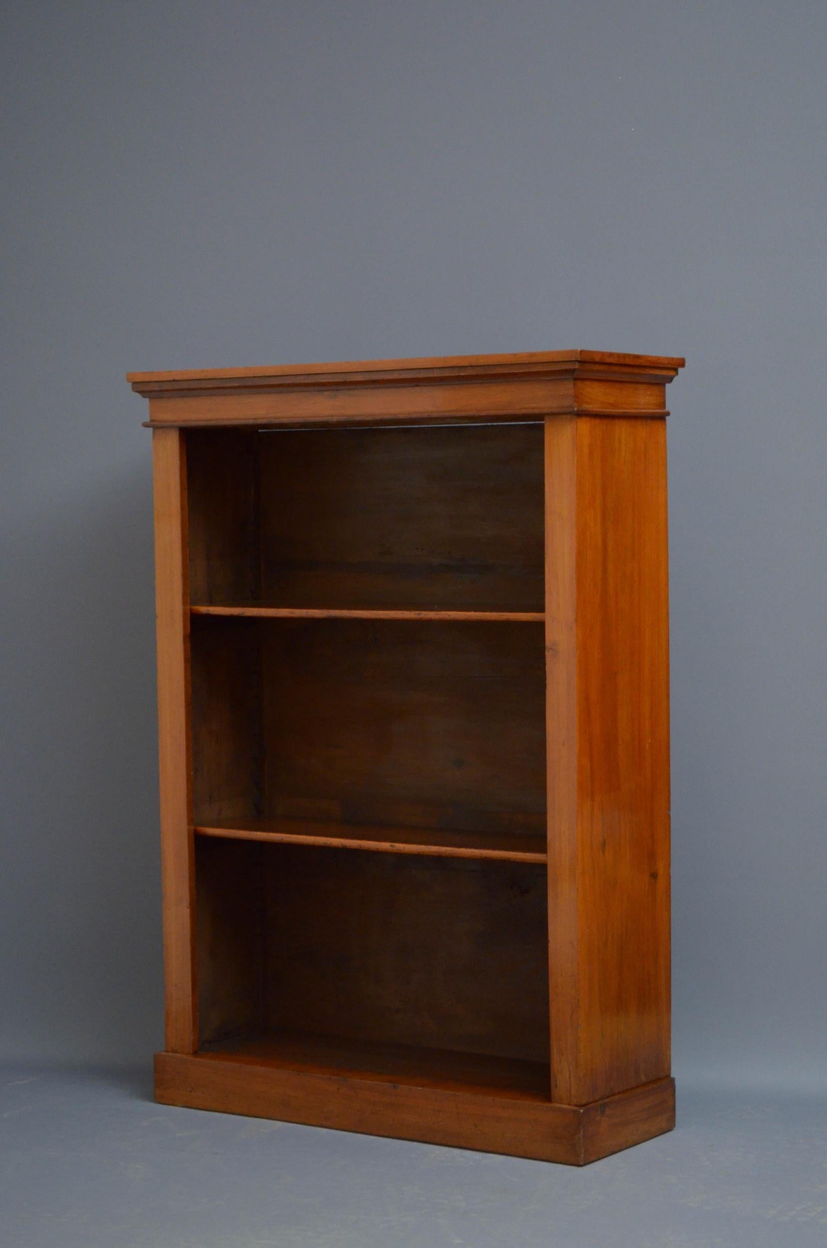 Sn5183 Late Victorian bookcase in walnut, having figured walnut top above two height adjustable shelves, standing on plinth base. This antique bookcase retains its original finish which has been cleaned, revived and waxed, all in excellent home