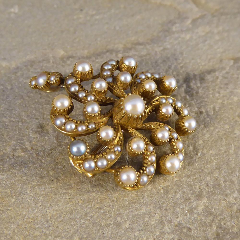 Such a lovely Antique piece that can be worn as either a brooch or pendant. In a floral pattern this pendant resembles a classic Late Victorian style using Seed Pearls which were often associated with purity, chastity and delicacy, making the