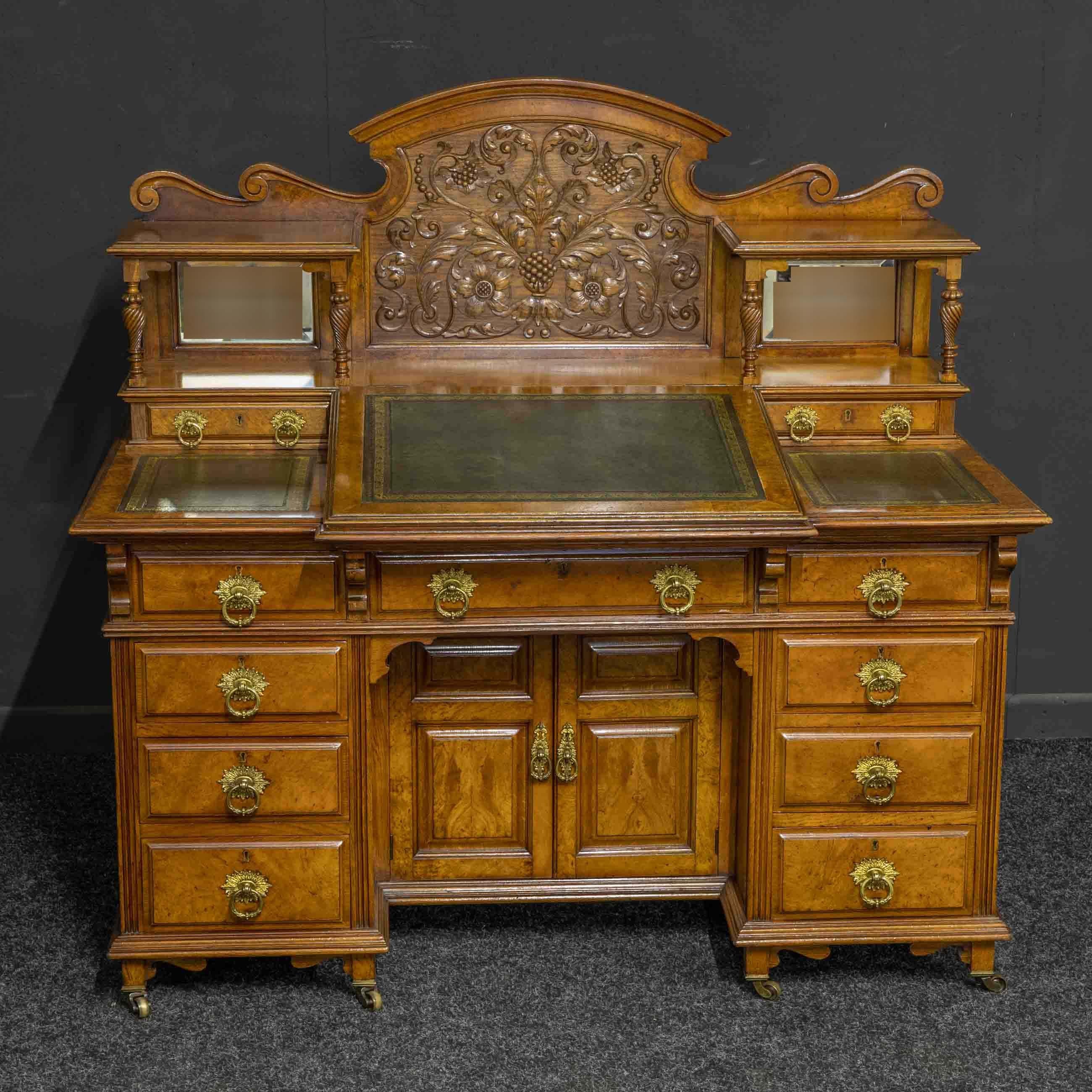 A magnificent late Victorian desk by the acclaimed cabinet makers Thomas Turner of Manchester, England. Highly unusual in design and most probably a one off special commission. Made from solid oak with pollard oak veneers to the more exposed areas,