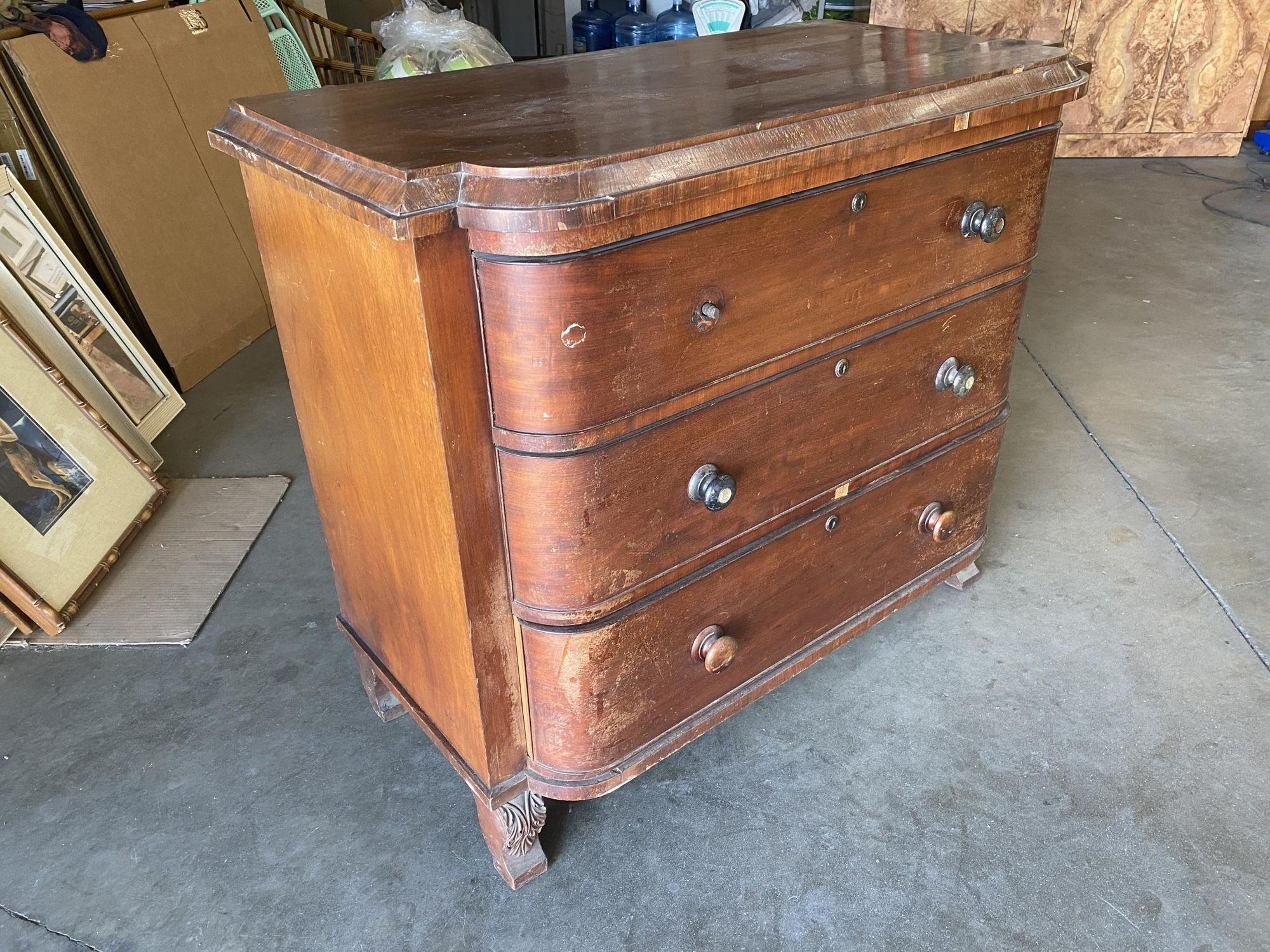 Late Victorian Queen Anne lowboy dresser featuring a sculpted front with 3 oversized drawers.