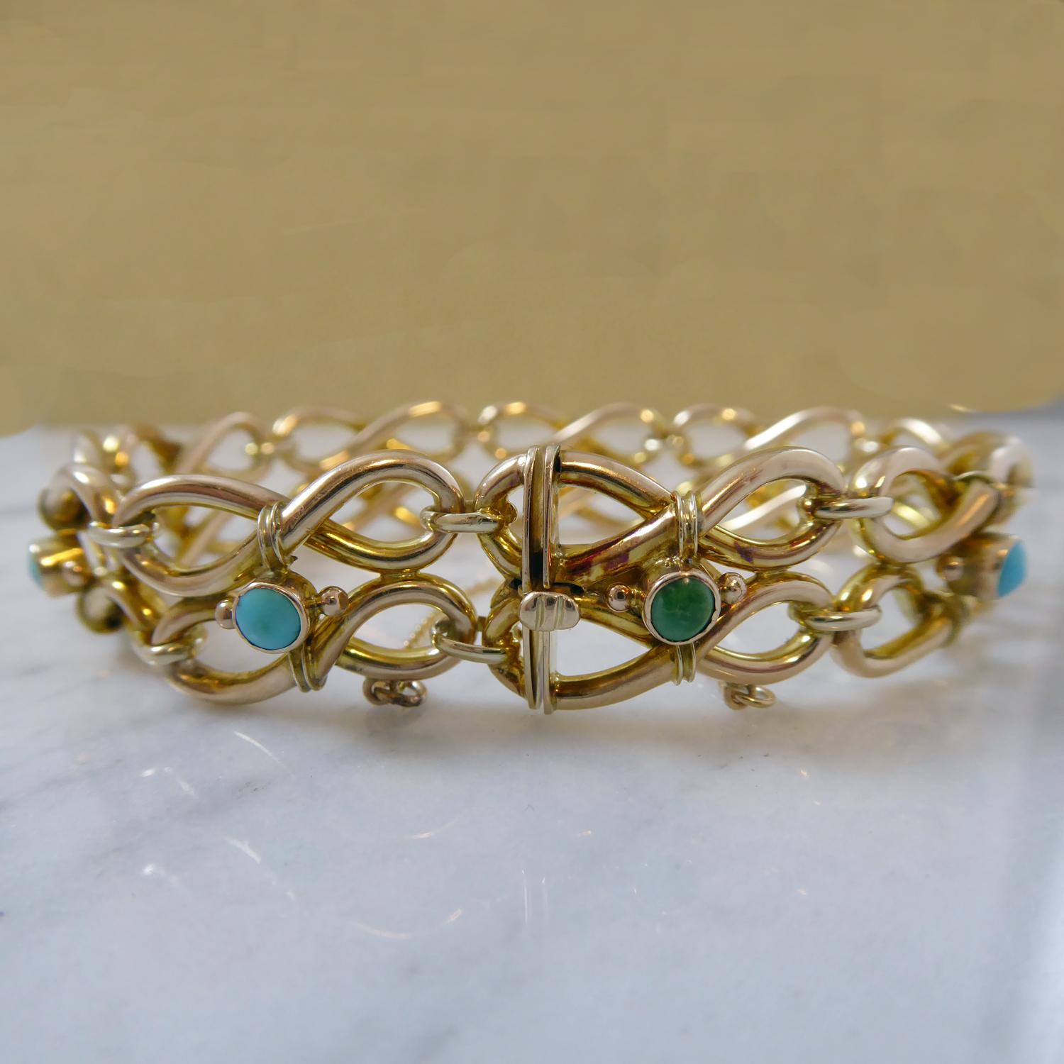Dating from the turn of the 20th century this lovely late Victorian bracelet comprises sections of double figure-8 fancy links, each pair of links accentuated with a collar set, cabochon cut turquoise, nine in total,  approx. 3.50mm diameter. 