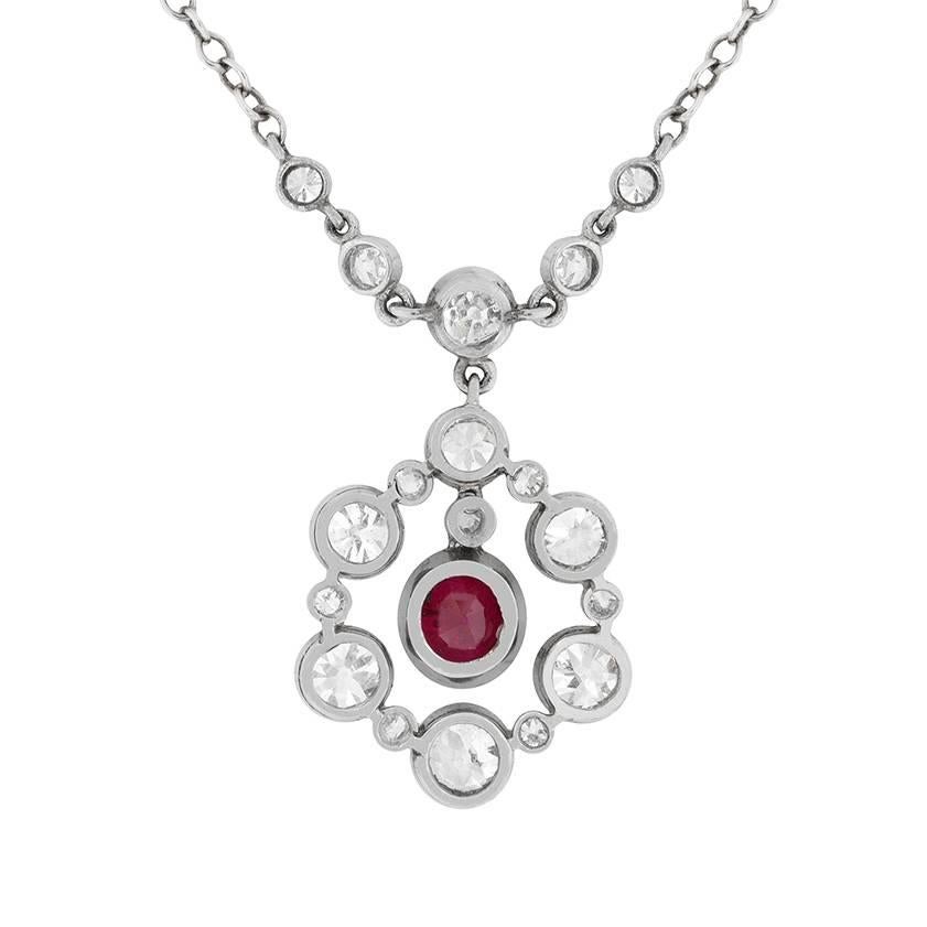 This wonderful necklace has a stunning centre ruby surrounded by diamonds. Dating back to the 1900s, the ruby has a lavish deep red colour and weighs 1.00 carat. It is then beautifully surrounded by a halo of old cut diamonds. They have total weight