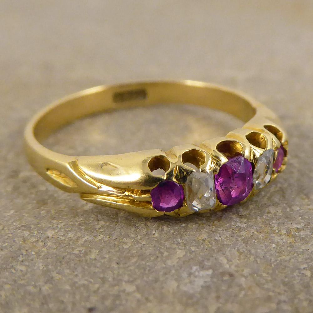 This Classic Late Victorian Five Stone Ruby and Diamond Ring is modeled in 18ct Gold. This piece has a wonderful period gallery, and looks exquisite on the hand! 

Ring Size: UK K or US 5.25 

Condition: Very Good, slightest signs of wear due to age