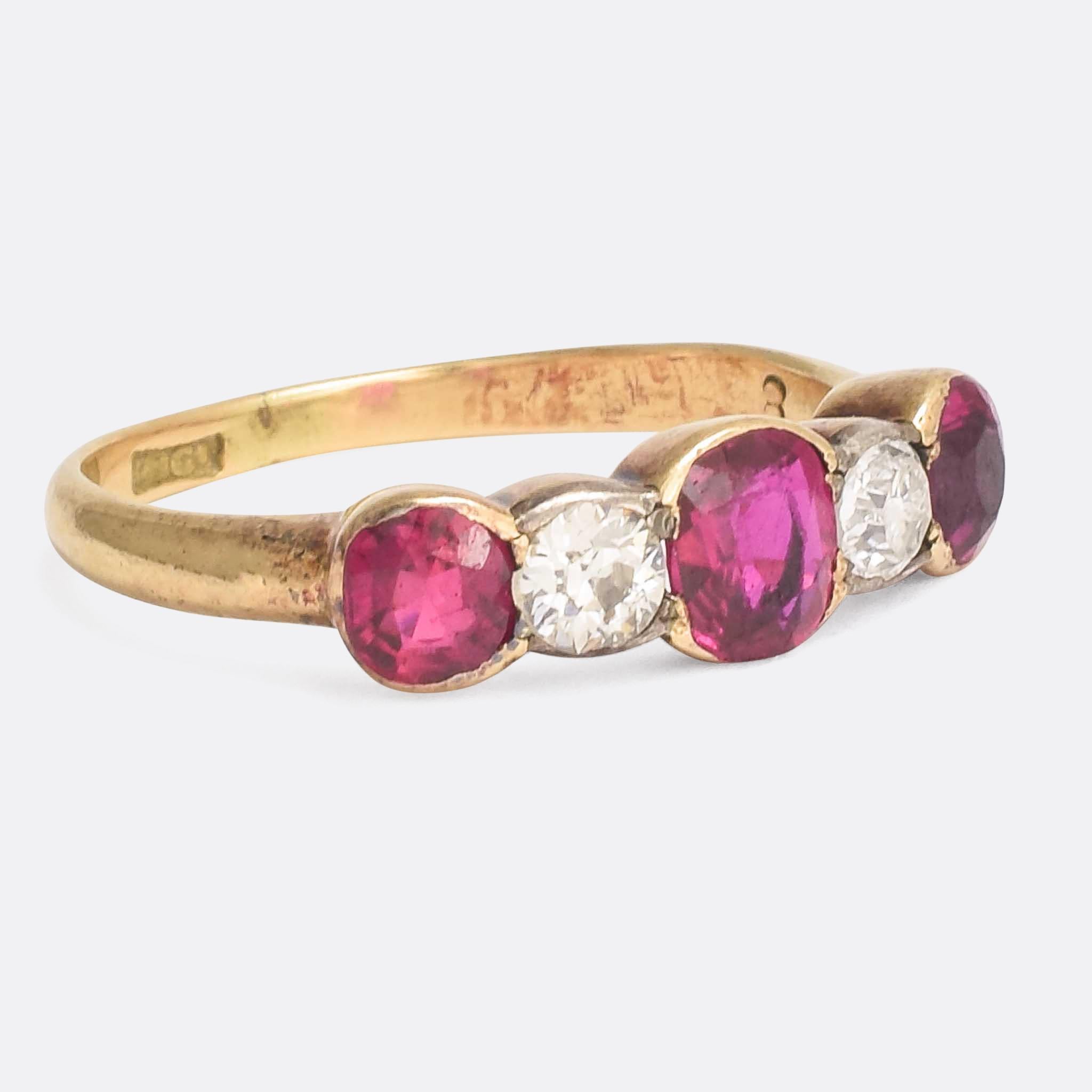 A cool antique 5-stone ring set with natural rubies and old cut diamonds. The stones rest in simple collet settings: the rubies in gold, and the diamonds set in silver to accentuate their icy white colour. It's well proportioned and modelled in 18