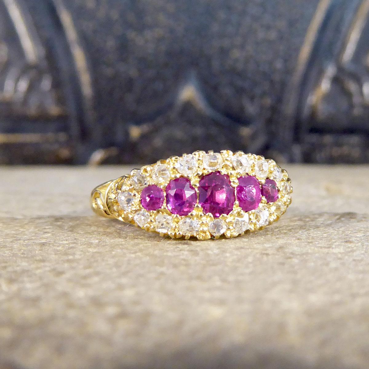 A true antique beauty, this gorgeous ring was hand crafted in the Late Victorian era, showing such quality craftsmanship and stones used. This ring features five bright and beautiful Rubies with a cluster of Rose cut Diamonds in claw settings