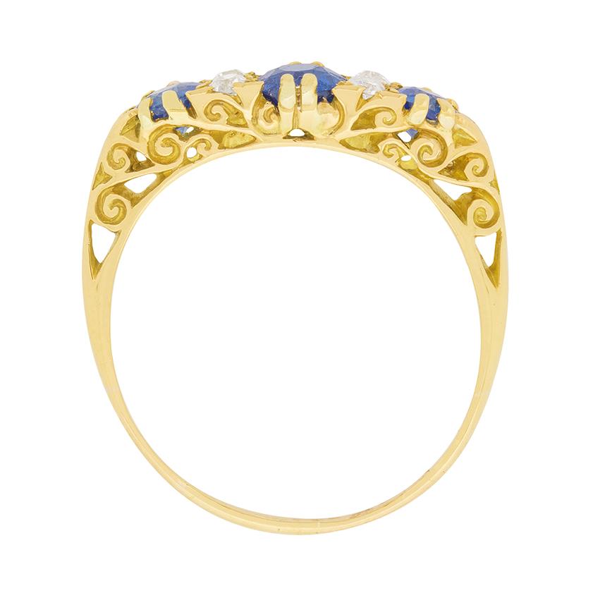 The turn of the twentieth century produced this classic late Victorian era ring featuring a spirited trio of old cut sapphires alternating with vertically-set pairs of sparkling old cut diamonds with a total of 0.20 carats.

These antique stones