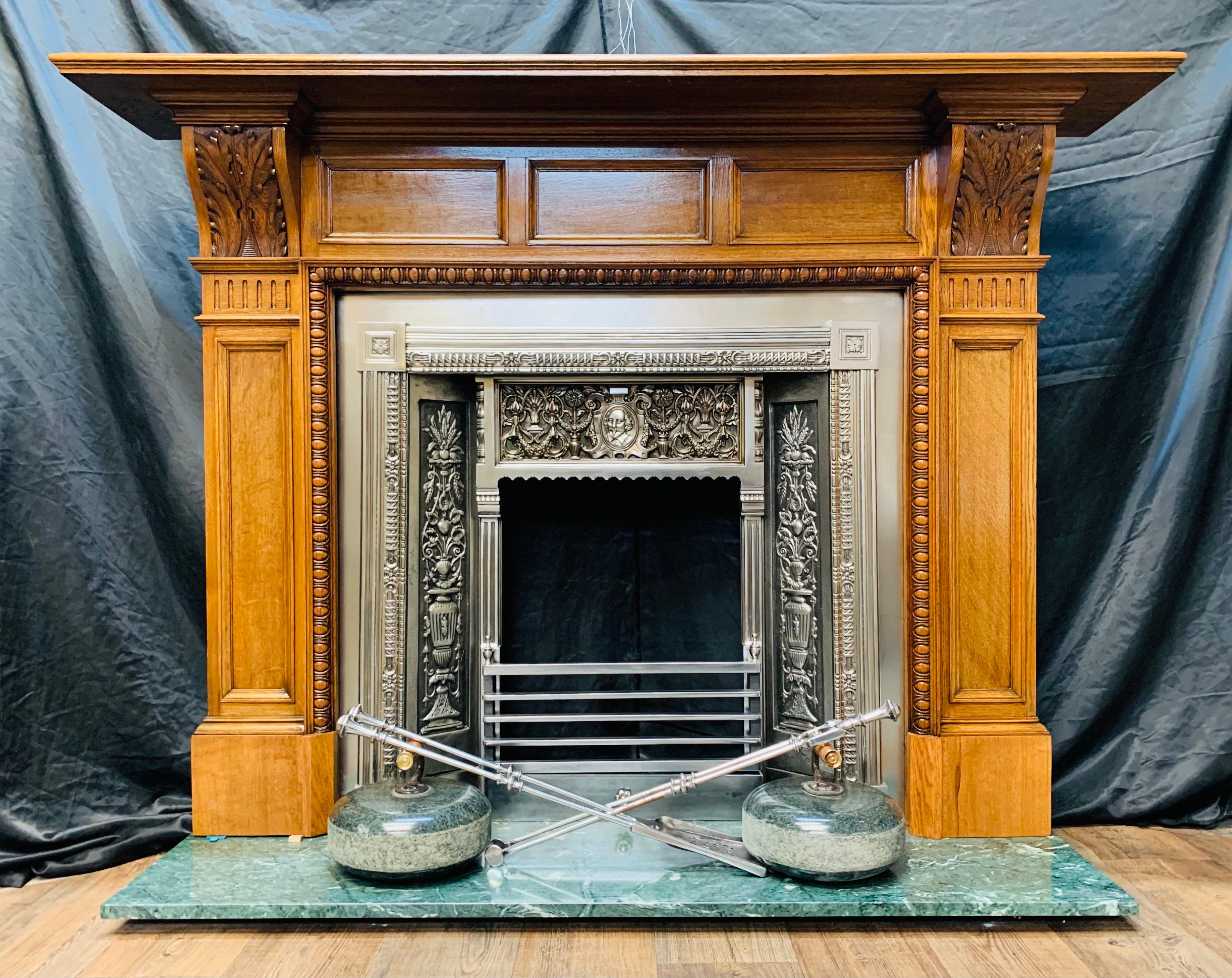 A very beautiful late Victorian Scottish Figured Oak Corbel fireplace surround in the Lorimer manner. A substantial moulded shelf sits above a frieze displaying three recessed moulded panels, flanked by well carved high relief corbels showing