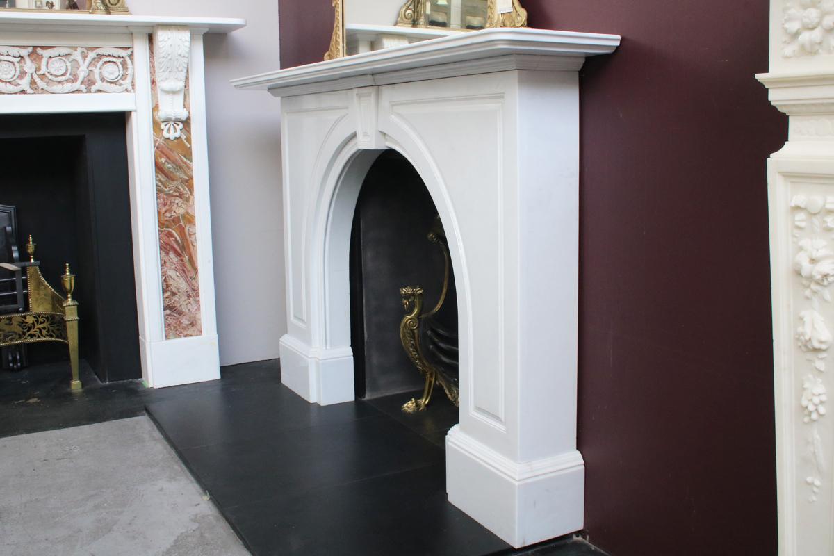 English Late Victorian Statuary Marble Fireplace with an Arched Aperture