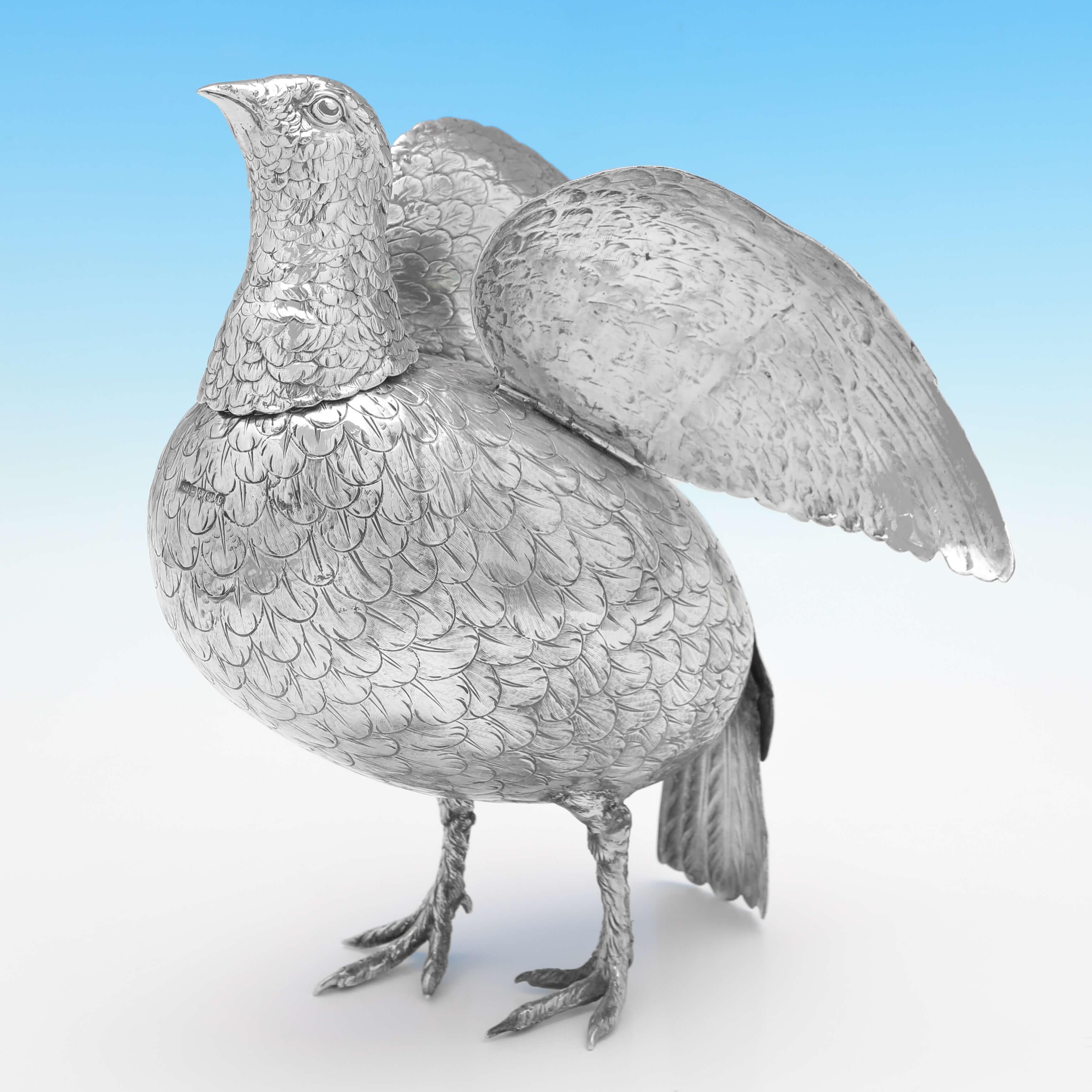 Carrying import marks for Chester in 1901 by Berthold Muller, this charming, Antique Sterling Silver Model of a Partridge, has a removable head, and moveable wings. 

The partridge measures 11