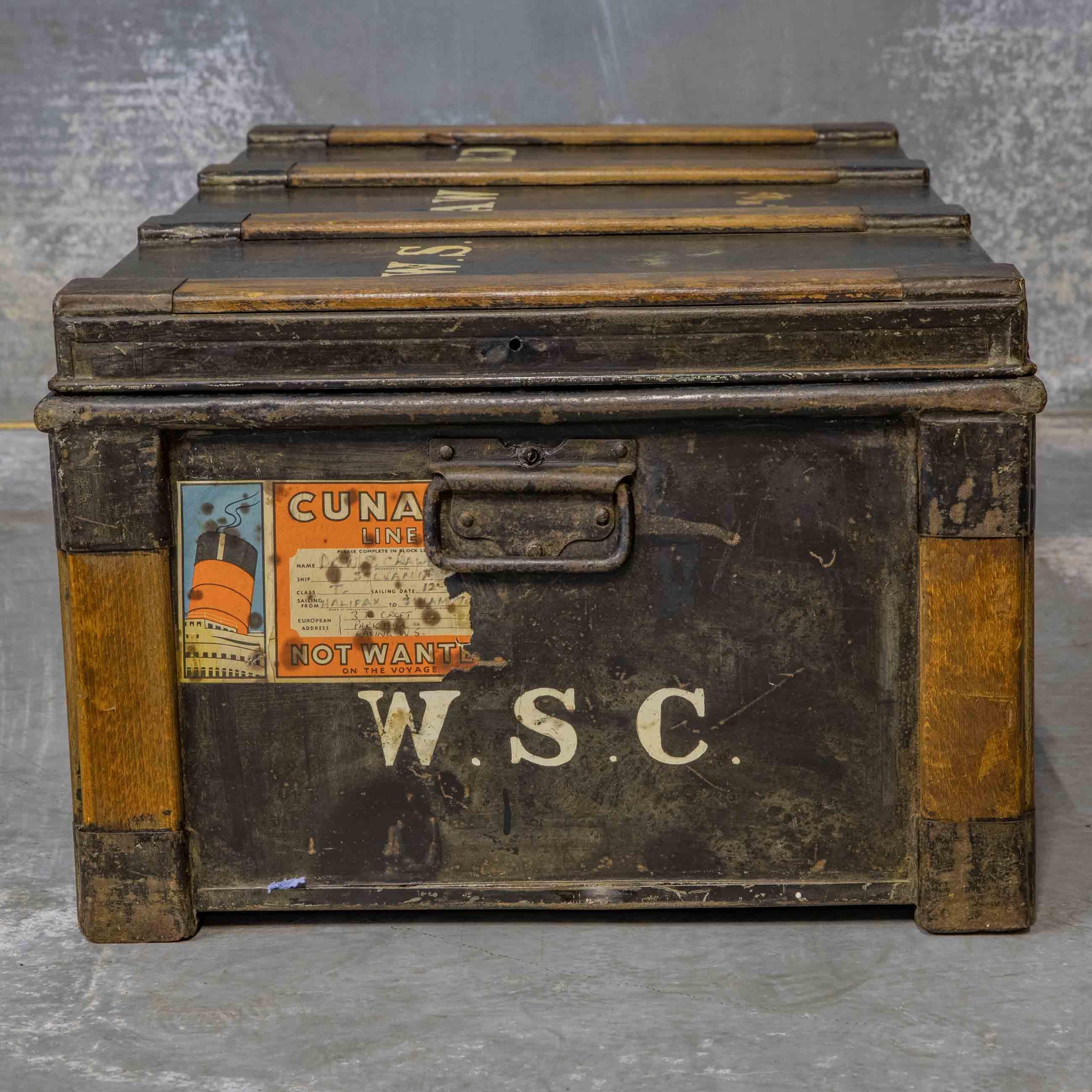 A good solid late Victorian tin travelling trunk with a black lacquered finish and clasped beech protective strappings to all sides. Internally it has it's original coppered finish which is unusual. The hinges and leather straps are much later