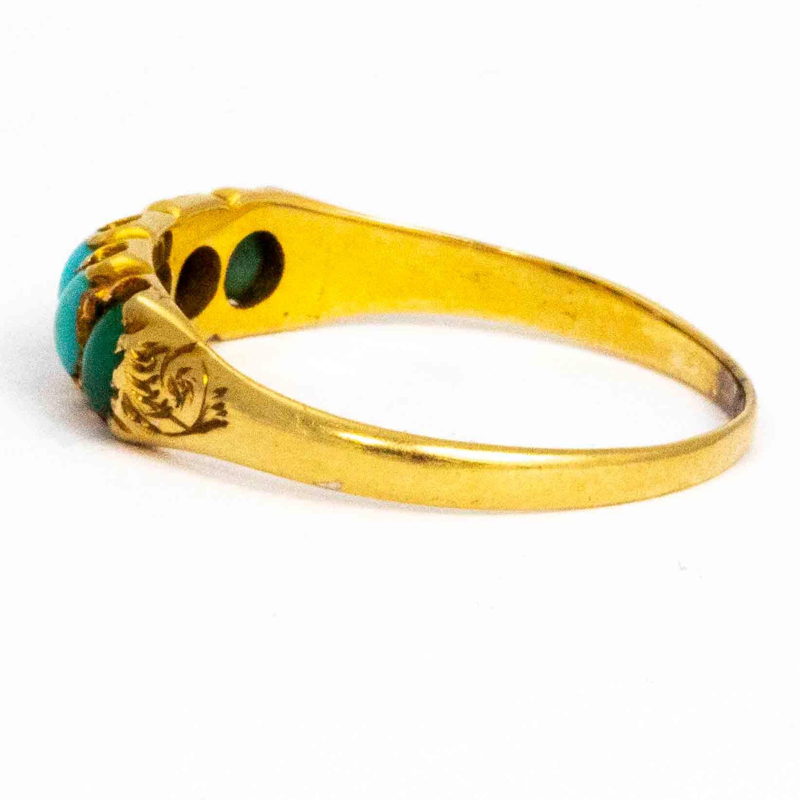 This ring is made in the late victorian era and the pop of the blue stones look stunning next to the yellow gold. The five turquoise stones in this ring are held in an ornate setting and pretty engraved shoulders. The ring is modelled in 15ct
