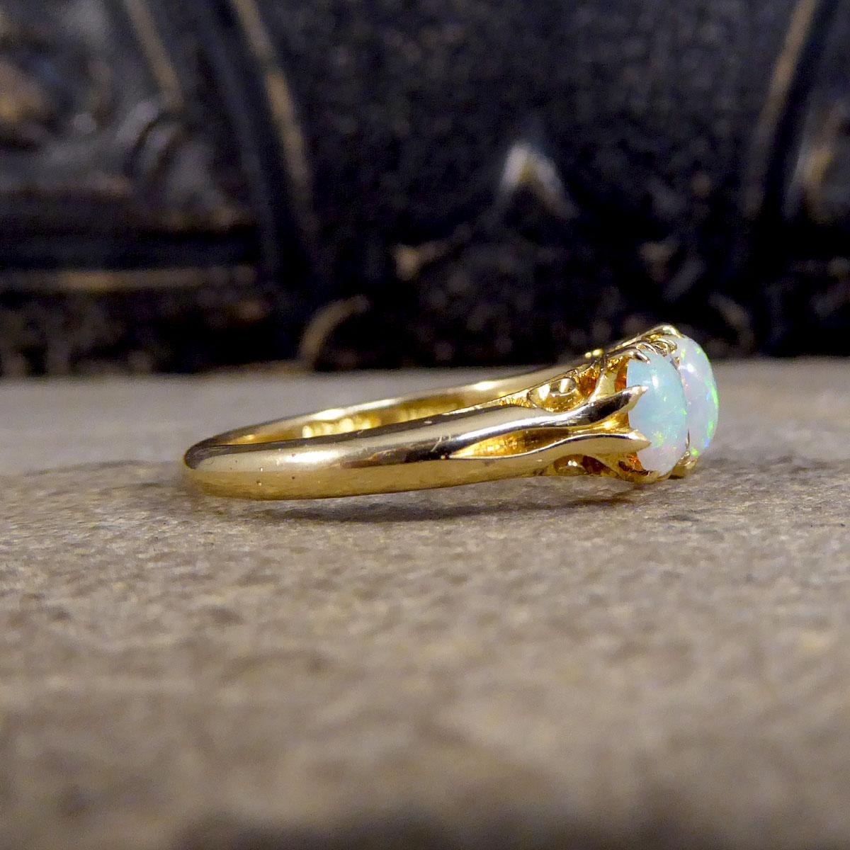 Oval Cut Late Victorian Vibrant Opal Three Stone Ring with Diamond Spacers in 18ct Gold