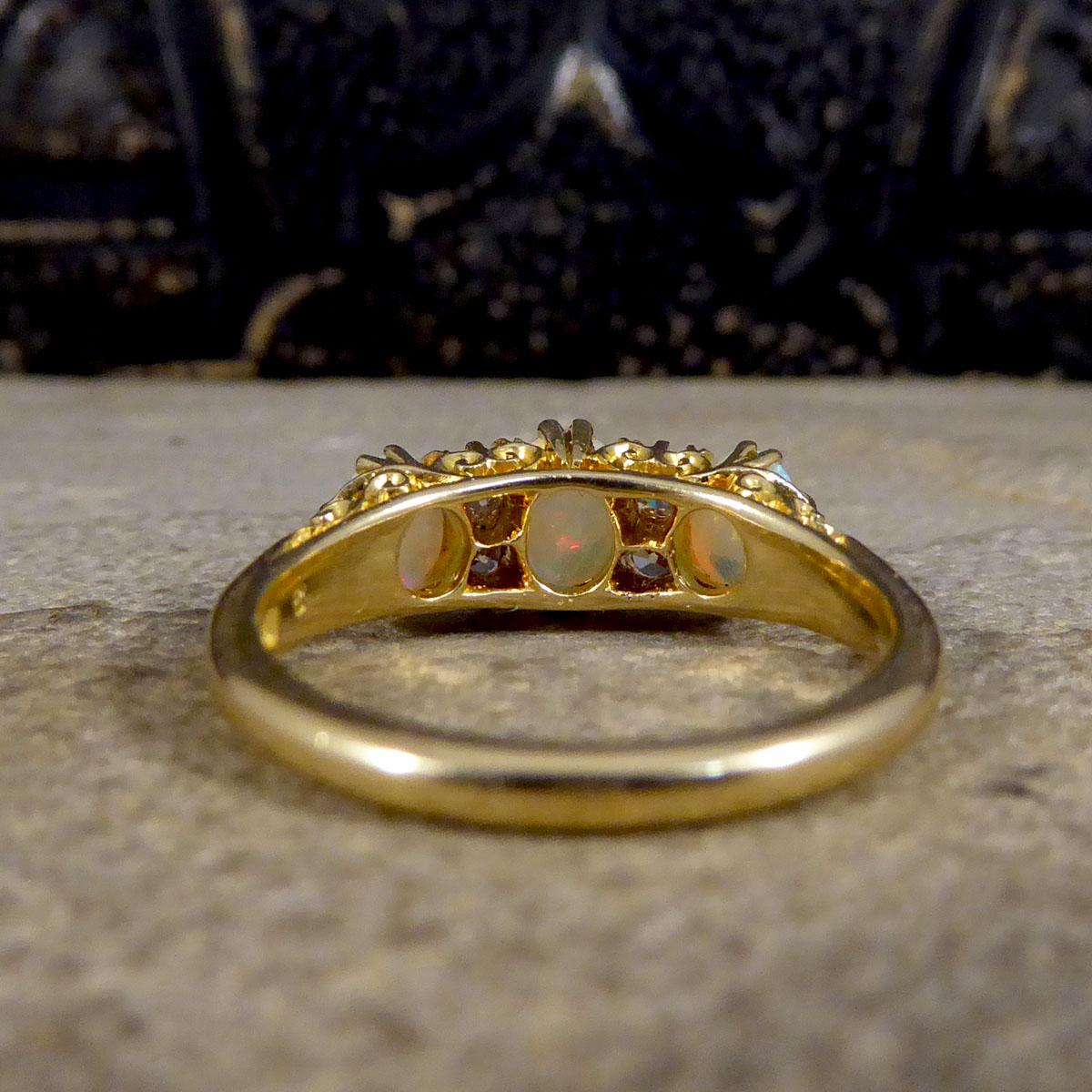 Late Victorian Vibrant Opal Three Stone Ring with Diamond Spacers in 18ct Gold In Good Condition In Yorkshire, West Yorkshire