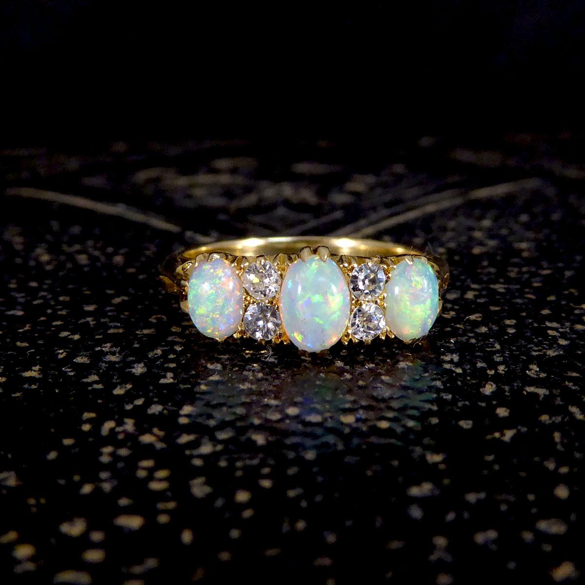 Late Victorian Vibrant Opal Three Stone Ring with Diamond Spacers in 18ct Gold 1