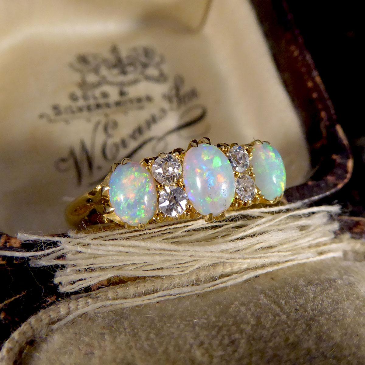 Late Victorian Vibrant Opal Three Stone Ring with Diamond Spacers in 18ct Gold 3