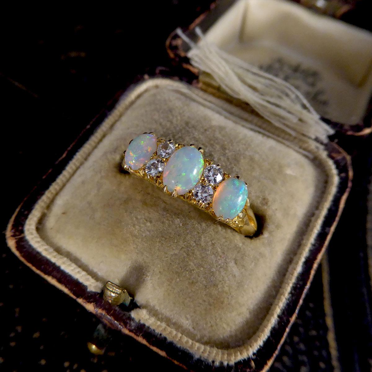 Late Victorian Vibrant Opal Three Stone Ring with Diamond Spacers in 18ct Gold 4