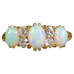 Late Victorian Vibrant Opal Three Stone Ring with Diamond Spacers in 18ct Gold