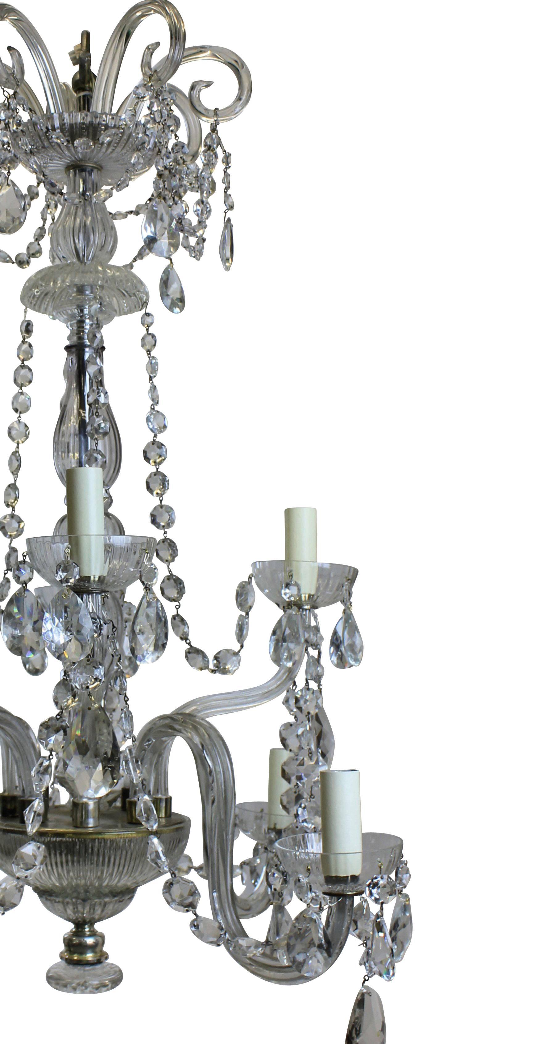 A French cut glass chandelier of good proportions, with scrolls and swags.
