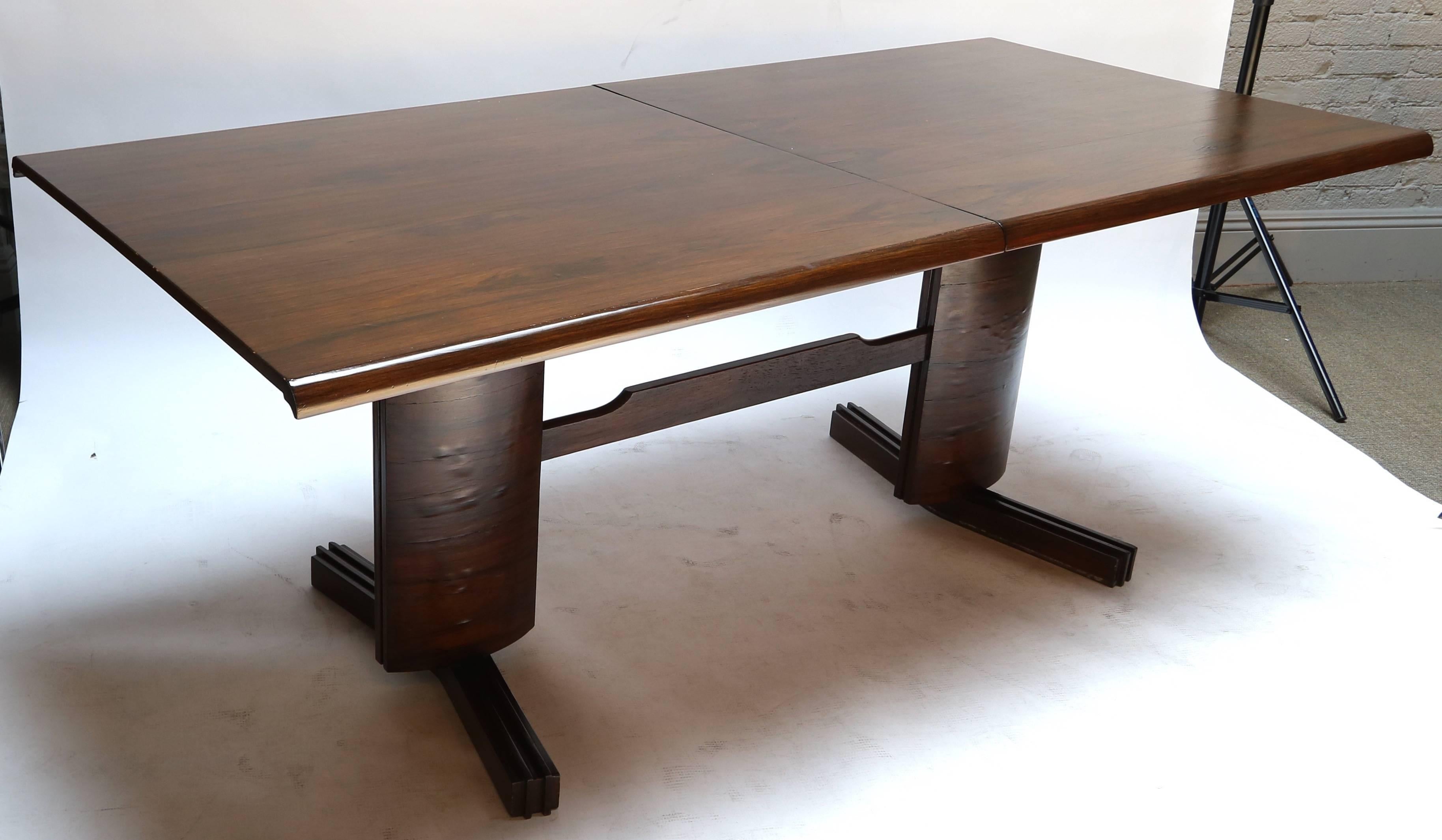 1950s spectacular Brazilian jacaranda dining table attributed to Julio Katinski for L'Atelier, Sao Paulo. The table has one leaf and extends to almost eight feet.

Length with leaf: 94.5