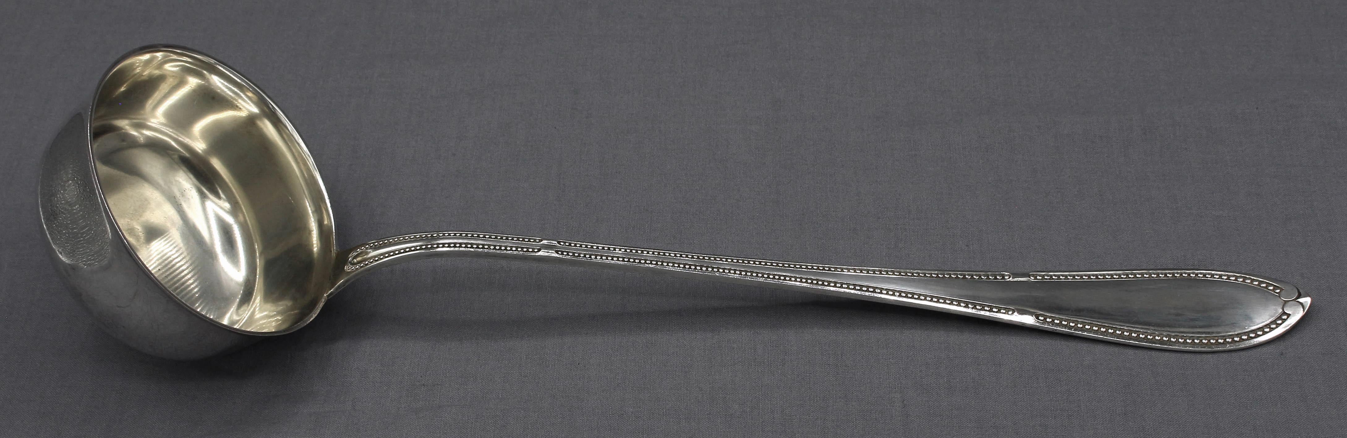Later 19th century German 800 silver standard punch ladle by Adolf Lewin. Boldly, elegant; beaded, pointed tip. Crown & moon marks. Never engraved. Fine condition. 6.95 troy oz.
13