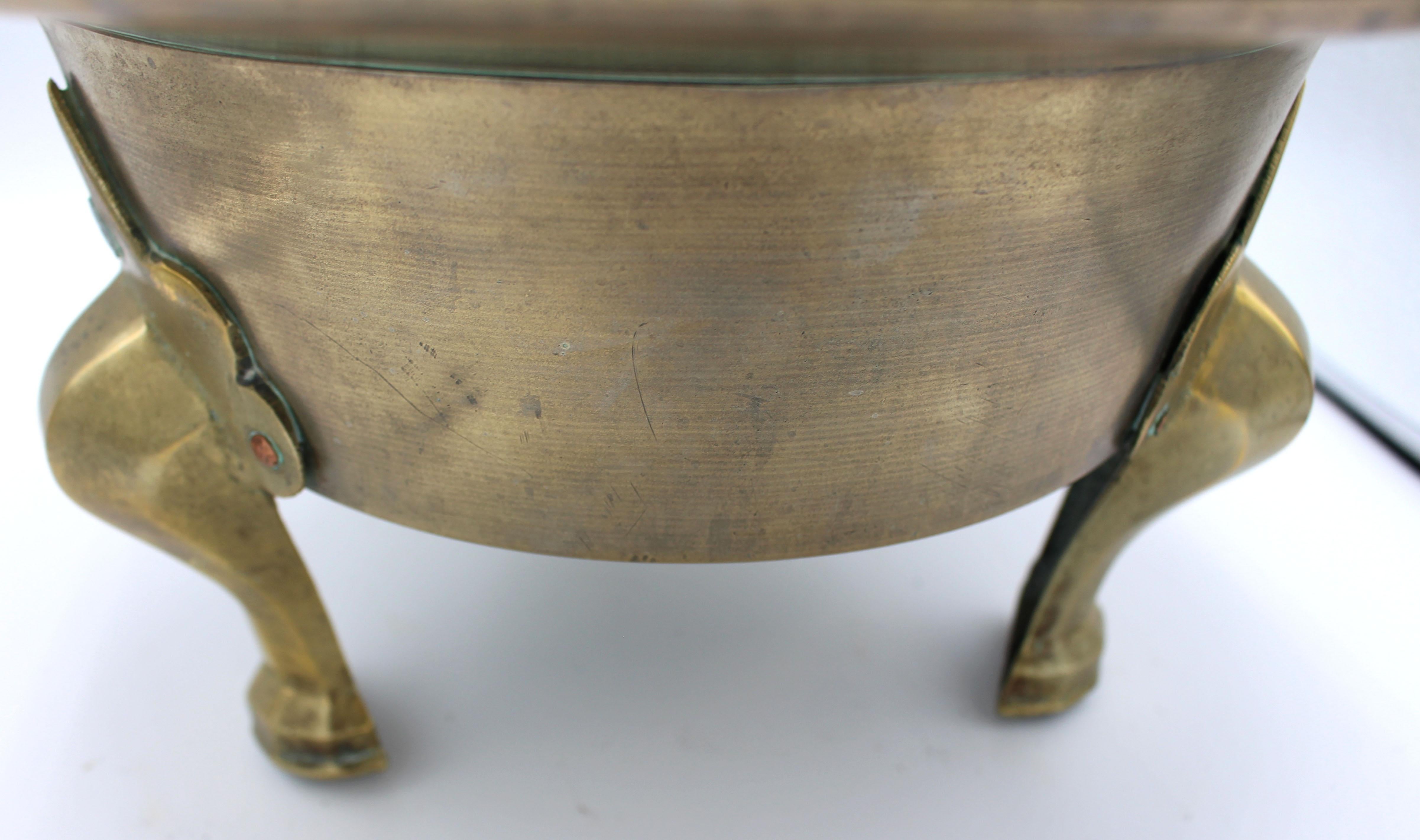 Later 19th century Korean brazier (Hibachi), brass on three legs. Heavy spun brass. The cartouche & cabriole molded shaped legs applied to the body with mostly copper rivets. Asian character marks on bottom, illegible.
14 3/8