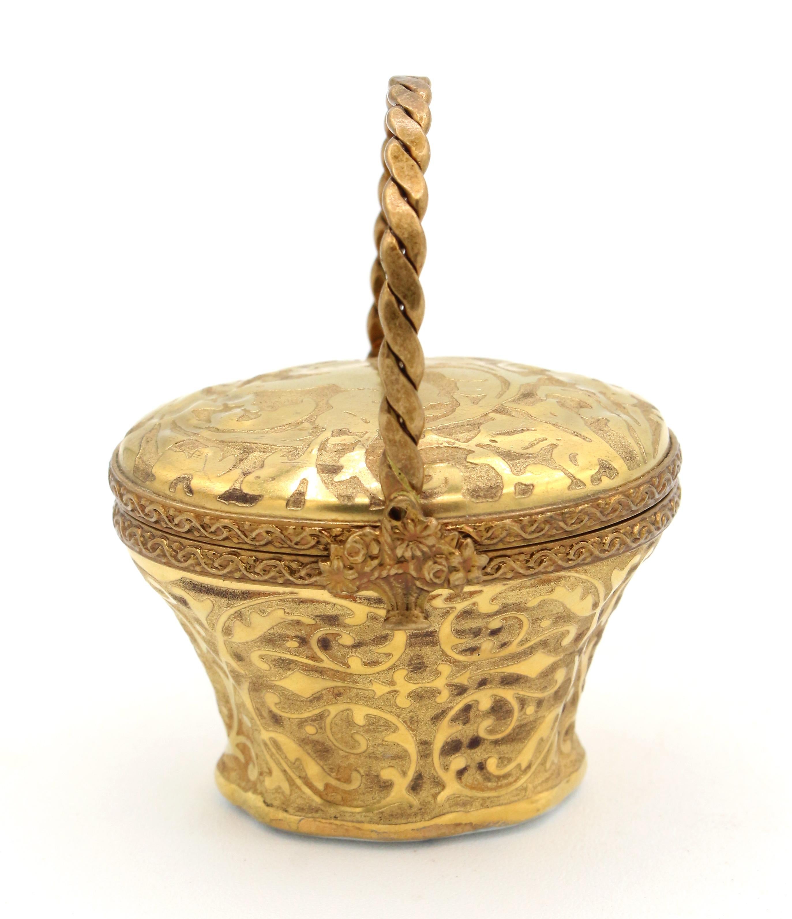 Limoges trinket or pill basket box, French, later 20th century. 24k gold encrusted porcelain. Marked: Limoges France, Peint main, Incrustation or fin (painted by hand, fine gold inlay), & artist's mark. Bas relief angel on top with scrolling leaves