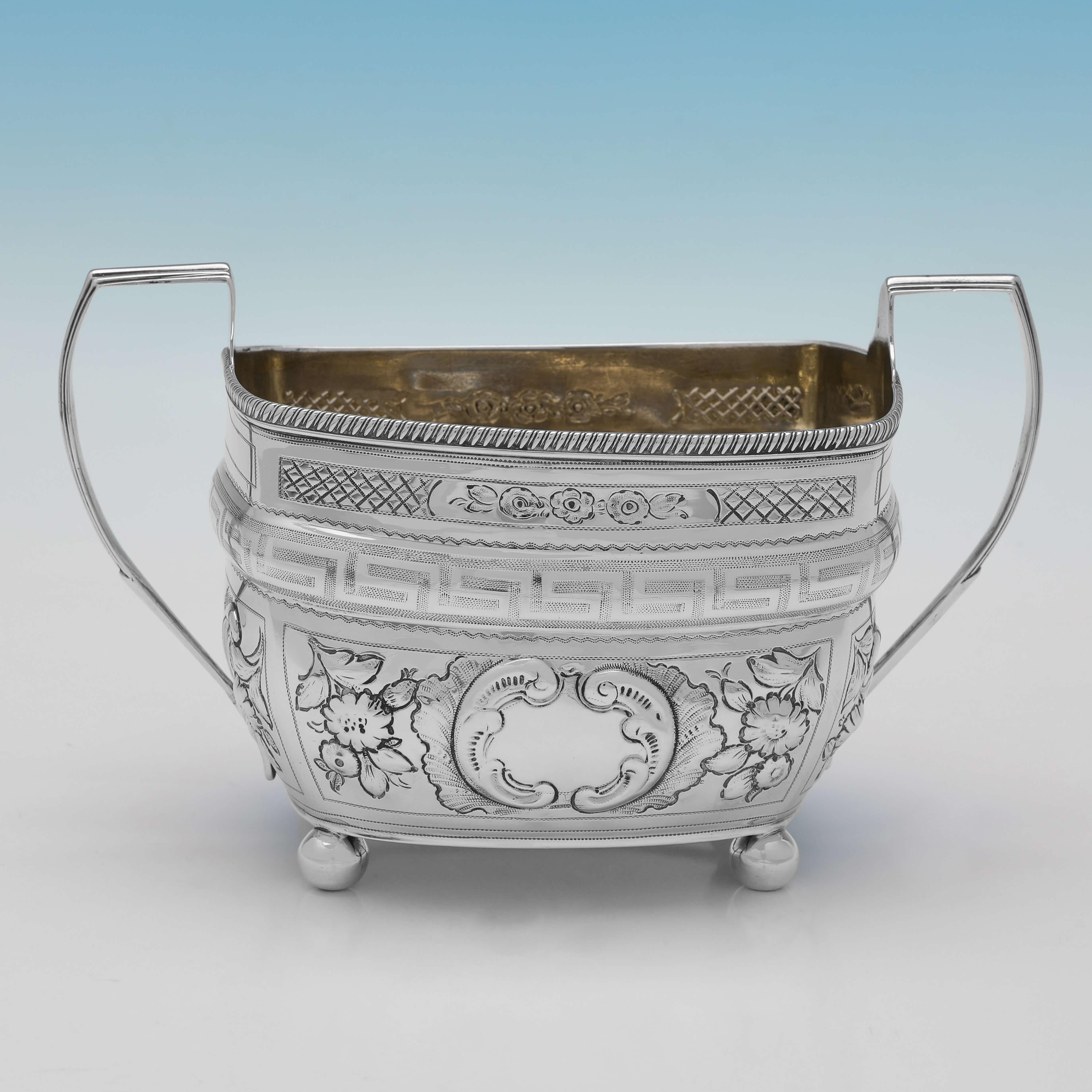 Hallmarked in London in 1804 and 1805 by Crispin Fuller, this George III, Antique Sterling Silver Sugar and Cream Set, have been later chased. 

The sugar bowl measures 4.25