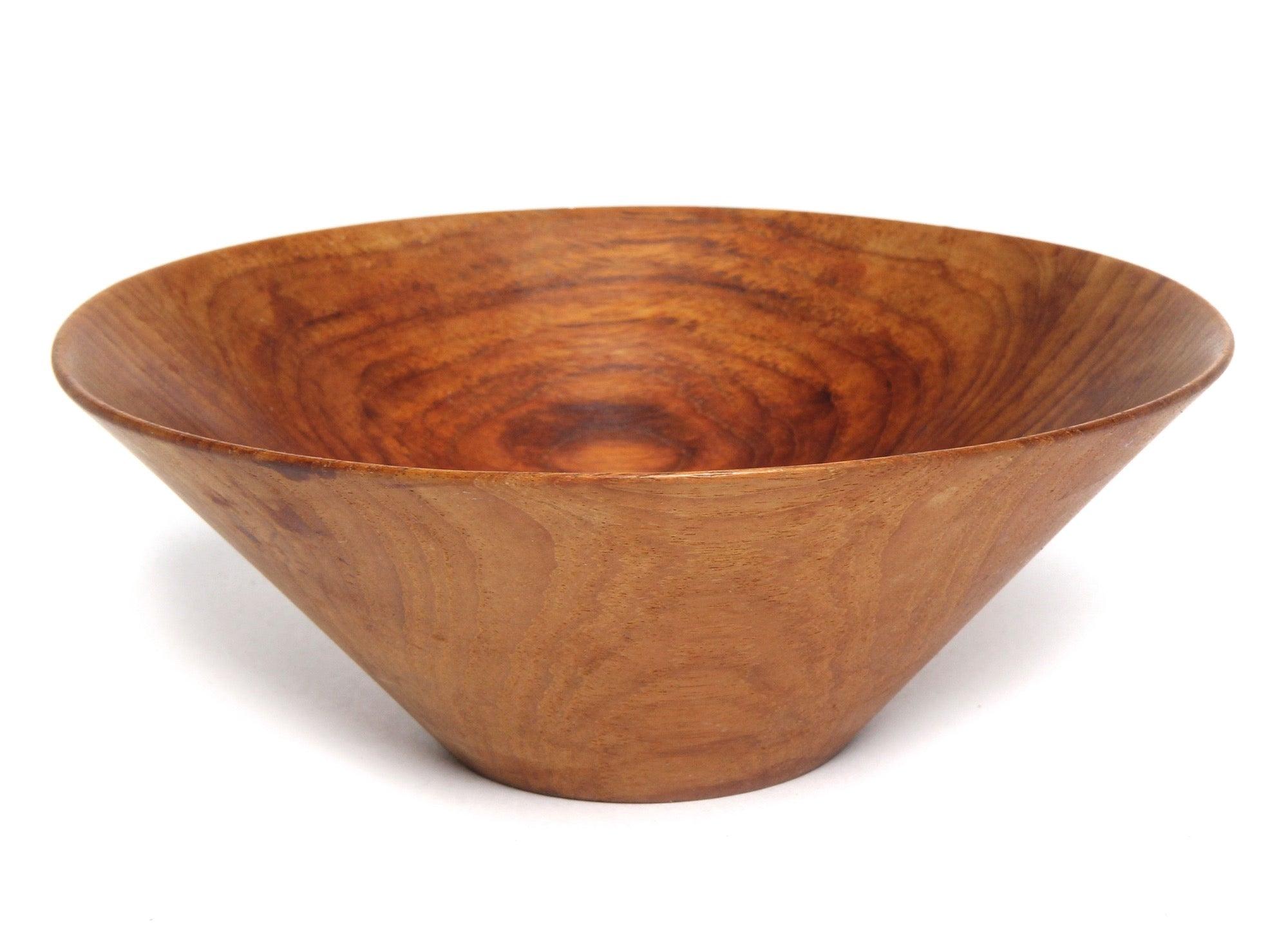 A thin walled lathe turned active grained wood bowl having flaring conical form.