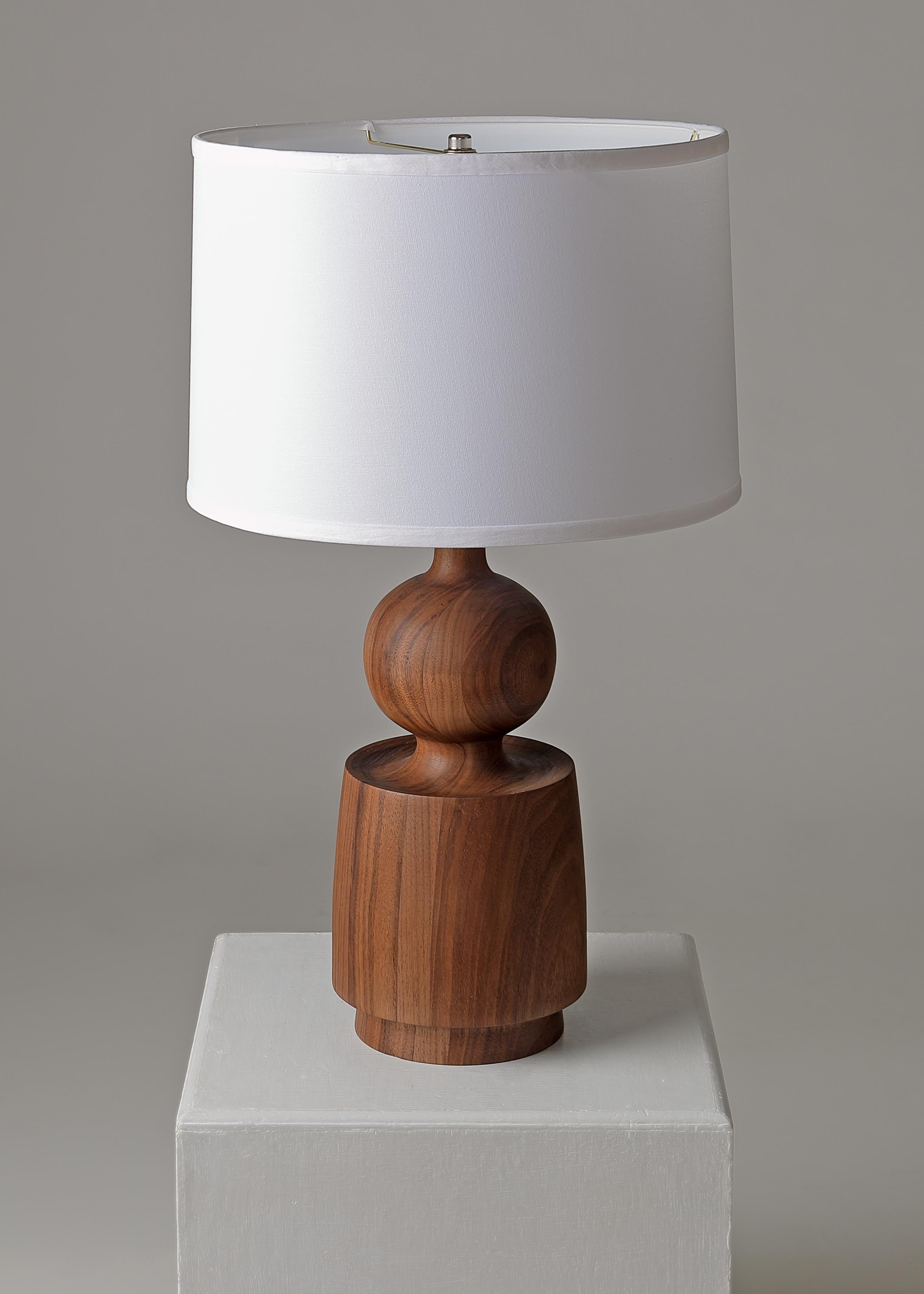 Lathe turned walnut table lamp 27 x 7 x 7 form (TWLB) by Michael Rozell. A similar, slightly taller model is listed, too. 
