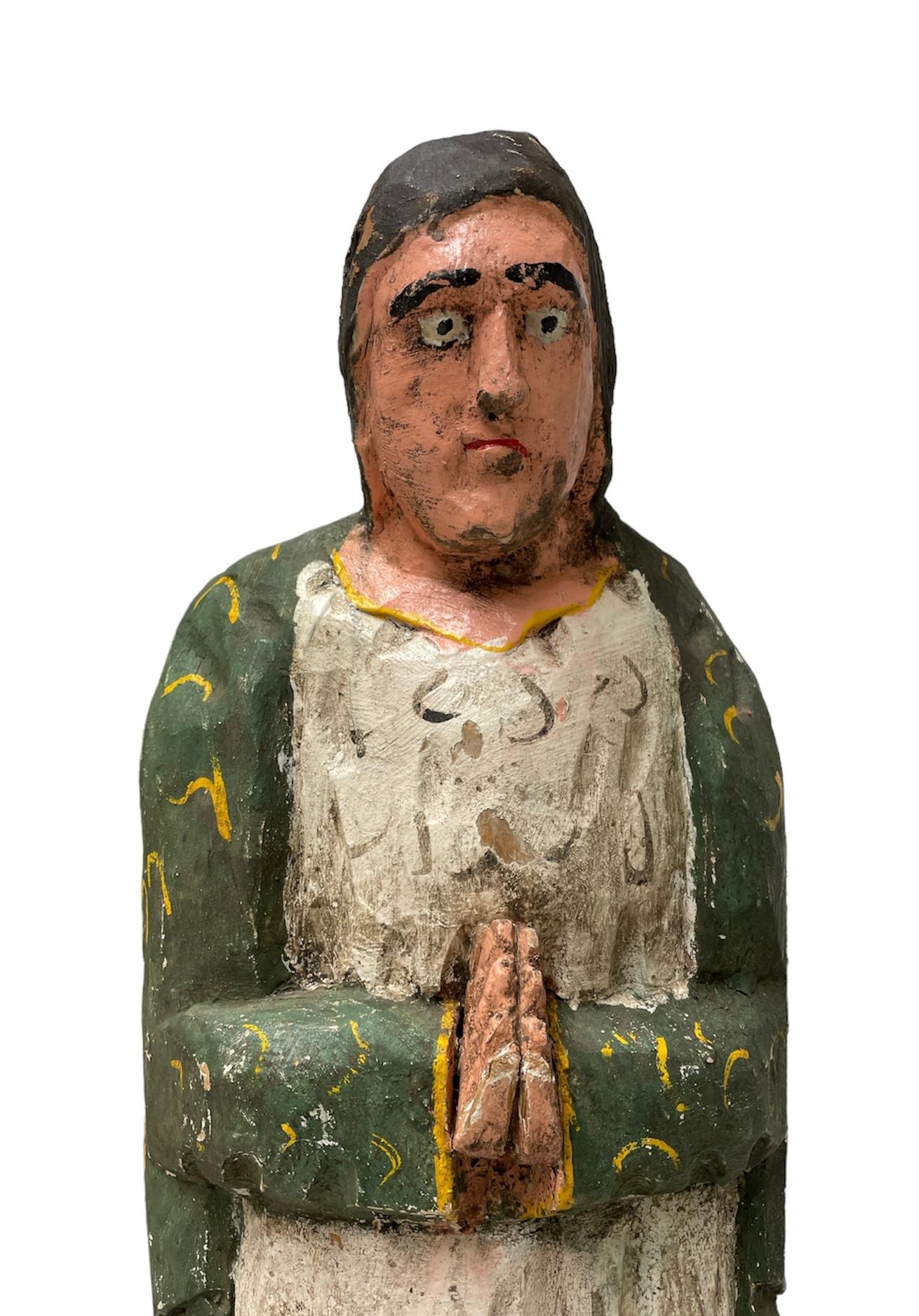 A renown tradition in Latin America the making of Santos de Palos by masters carvers since the 19th century. They hand carved and painted the saints inspired in their personal religious devotion. This is a Santos de Palos, Wood Carved Sculpture of
