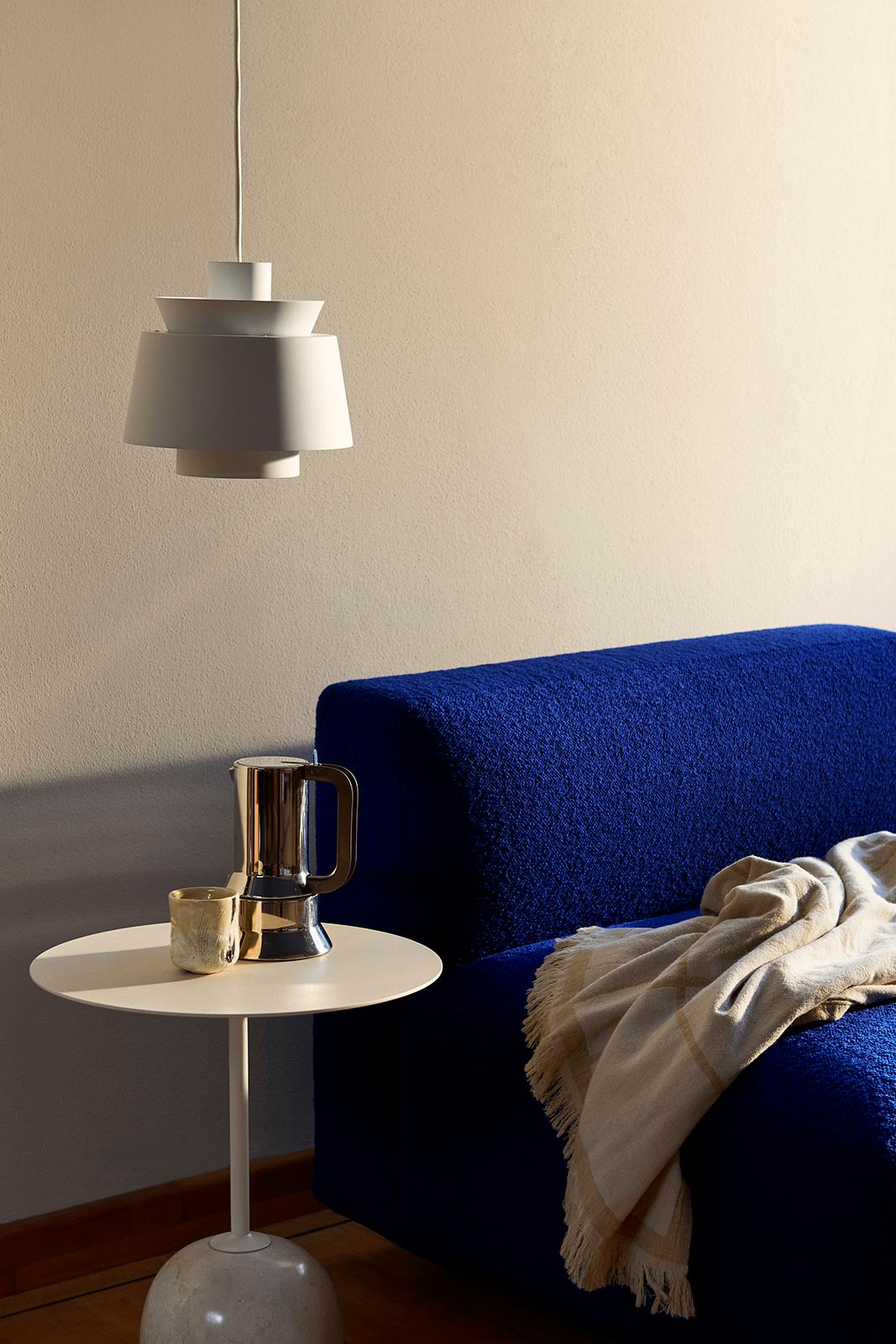 At first glance, Lato resembles a sculpture, with its slim, round table top balanced by an oval-shaped base. 
The marble is turned into shape on a lather and then honed to a semi matt finish. 
The table is made from white steel & crema diva
