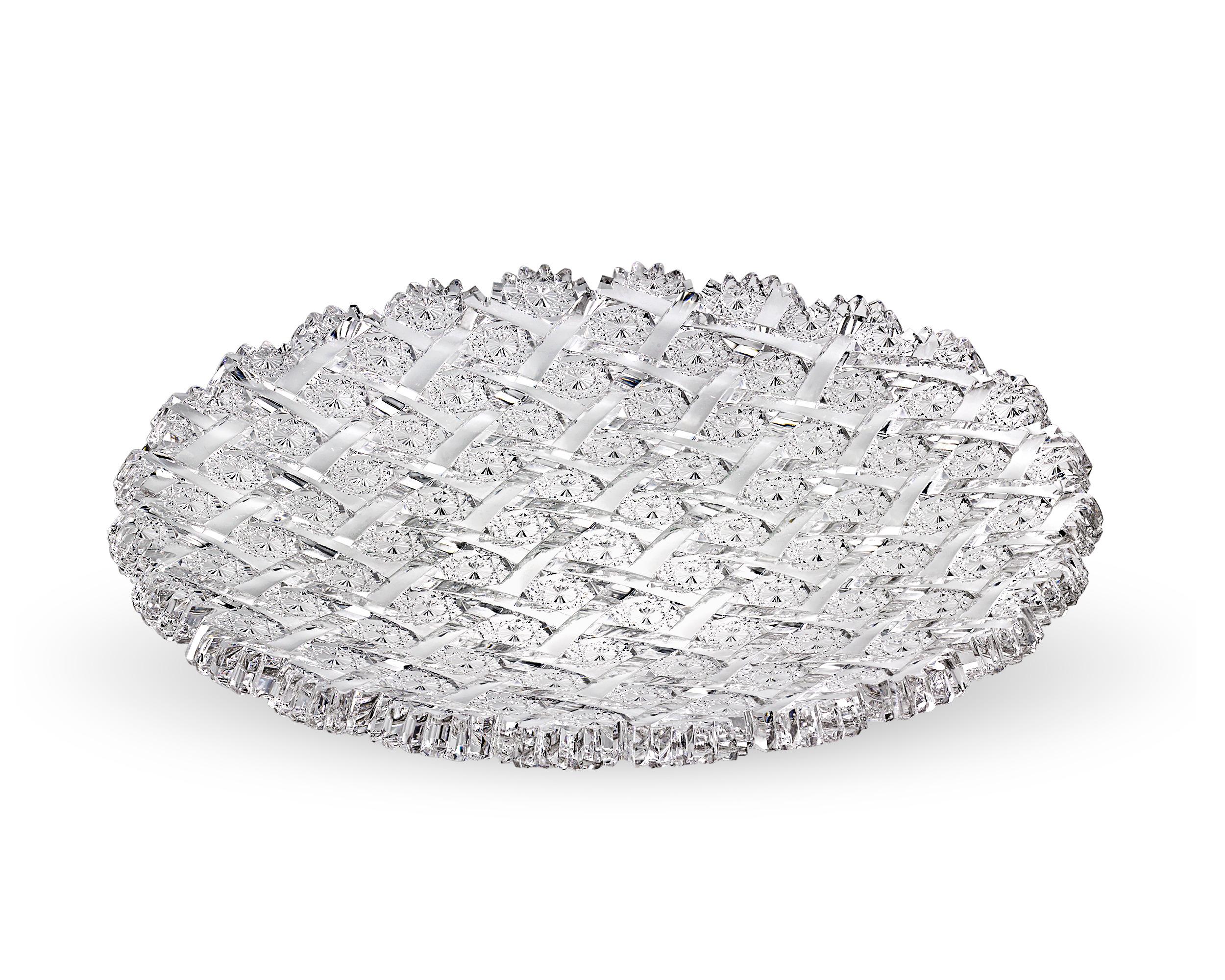 The Lattice and Rosettes pattern adorns this American Brilliant Period cut glass tray by the renowned T.G. Hawkes & Co. With its crisp scalloped rim, the tray provides the ideal canvas upon which this coveted pattern can be appreciated. Ribbons of
